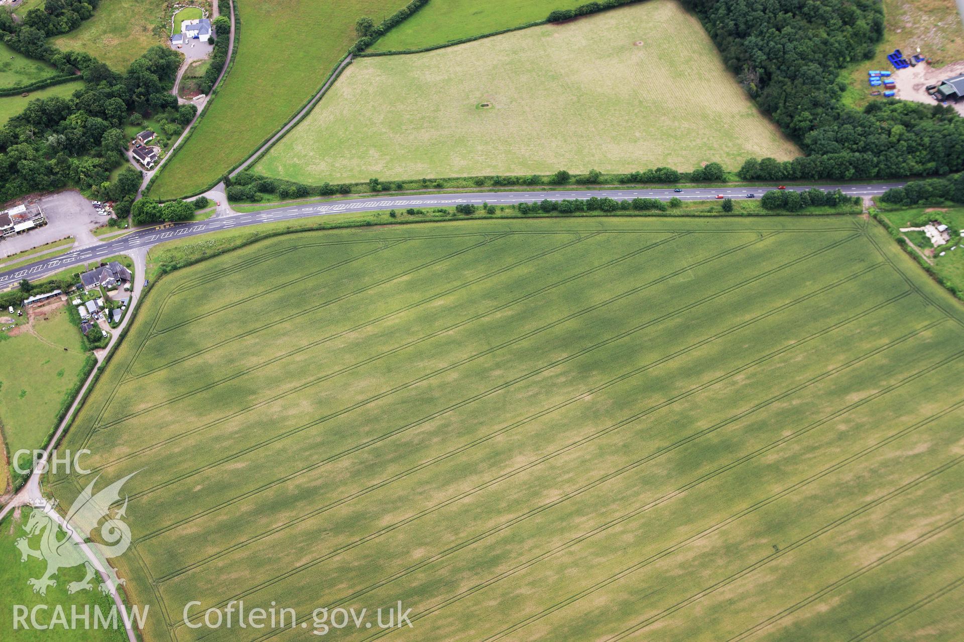 RCAHMW colour oblique aerial photograph of Five Lanes Roman Villa. Taken on 09 July 2009 by Toby Driver