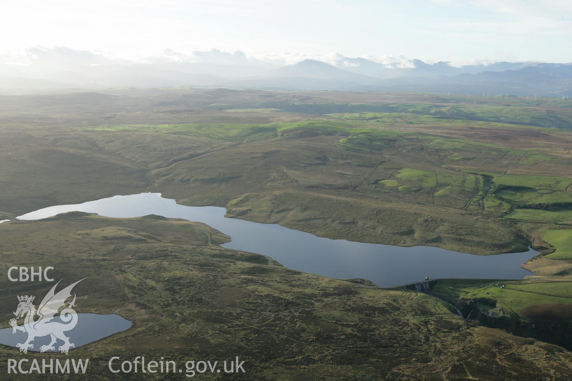 RCAHMW colour oblique aerial photograph showing landscape of Llyn Aled Isaf Mesolithic Occupation Site. Taken on 10 December 2009 by Toby Driver