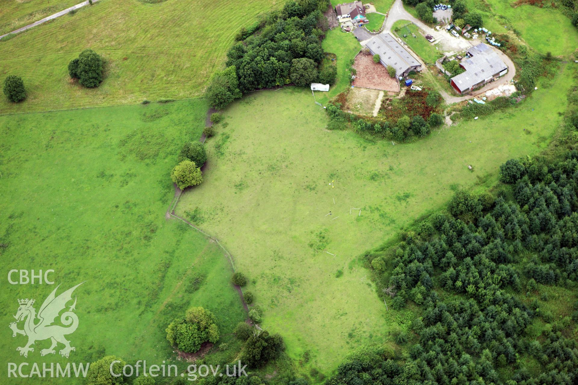 RCAHMW colour oblique aerial photograph of Llanwern Park, with cropmarks of dressage ring. Taken on 09 July 2009 by Toby Driver