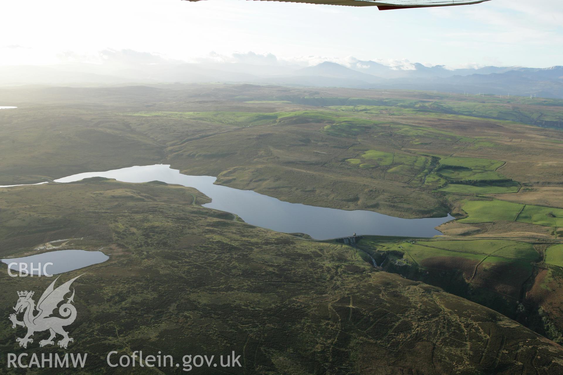 RCAHMW colour oblique aerial photograph showing landscape of Llyn Aled Isaf Mesolithic Occupation Site. Taken on 10 December 2009 by Toby Driver