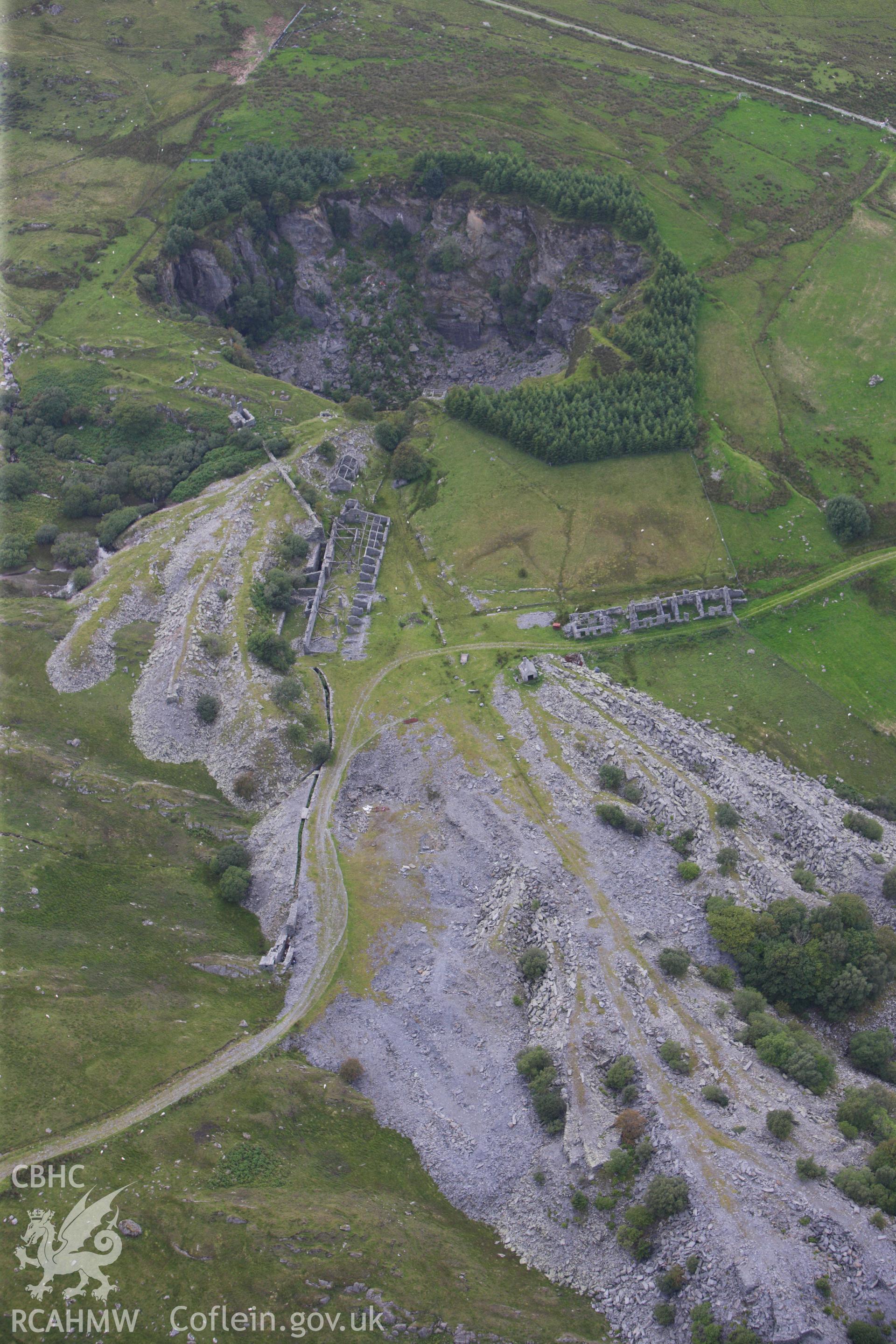 RCAHMW colour oblique aerial photograph of Rhos Quarry (Slate and Slab Works), Capel Curig. Taken on 06 August 2009 by Toby Driver
