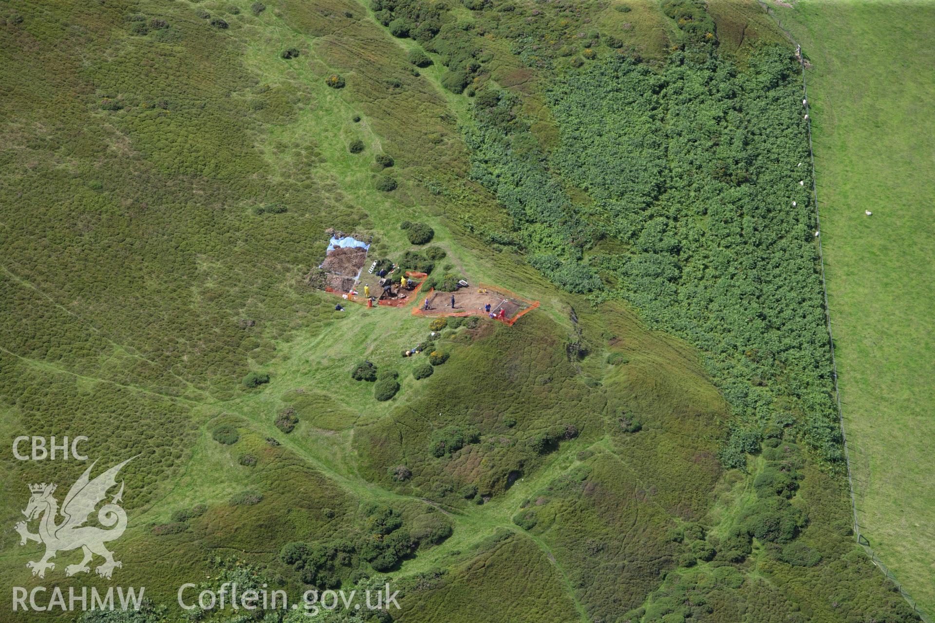 RCAHMW colour oblique aerial photograph of Moel-y-Gaer Hillfort, Llanbedr, with Bangor University excavations. Taken on 30 July 2009 by Toby Driver