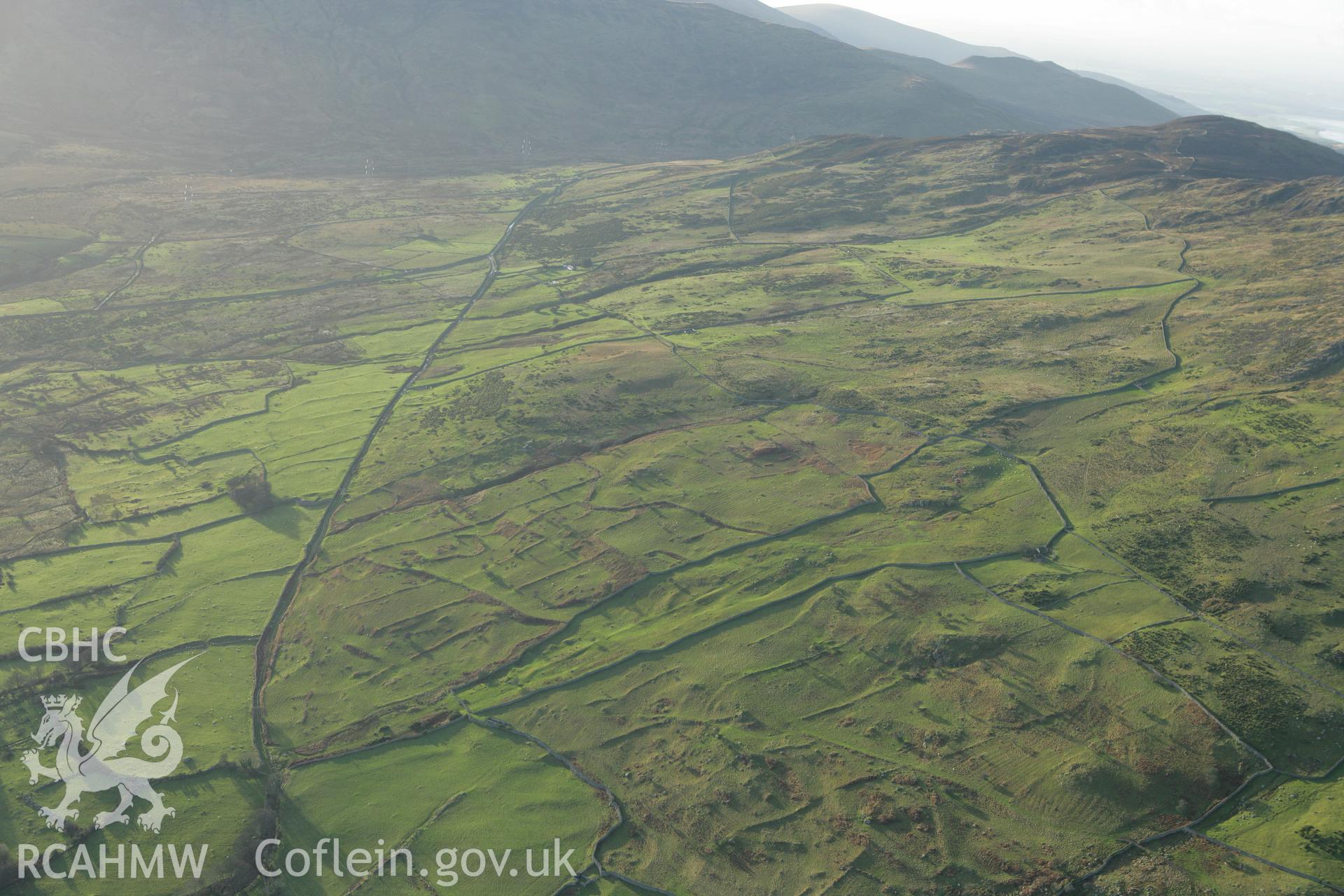 RCAHMW colour oblique aerial photograph of Maen-y-Bardd Settlement and field systems. Taken on 10 December 2009 by Toby Driver