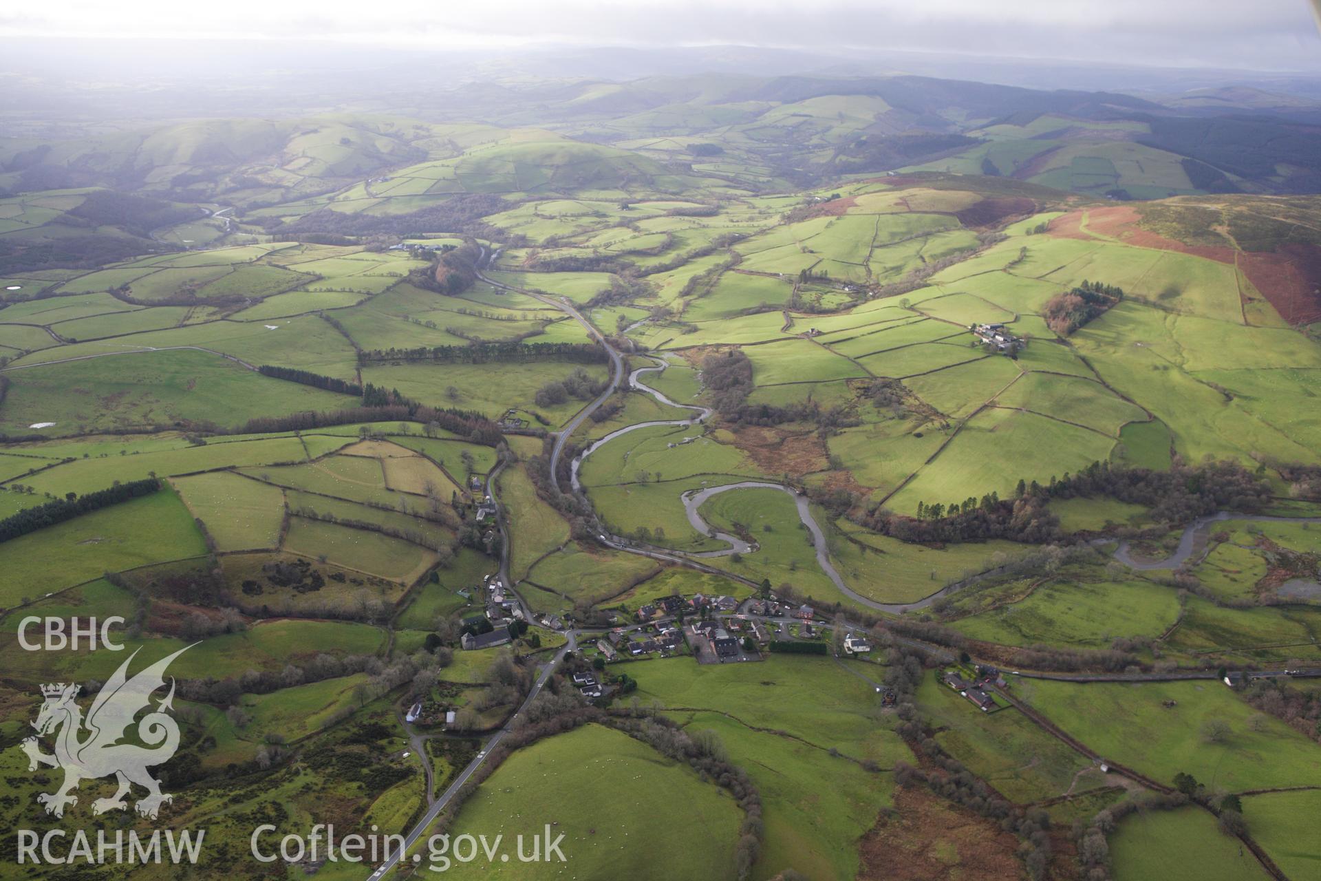 RCAHMW colour oblique aerial photograph of Llanbister showing view of landscape. Taken on 10 December 2009 by Toby Driver