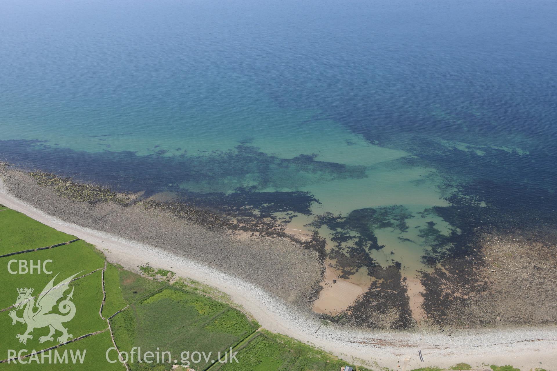 RCAHMW colour oblique aerial photograph of Llwyngwril Fish Trap II. Taken on 02 June 2009 by Toby Driver