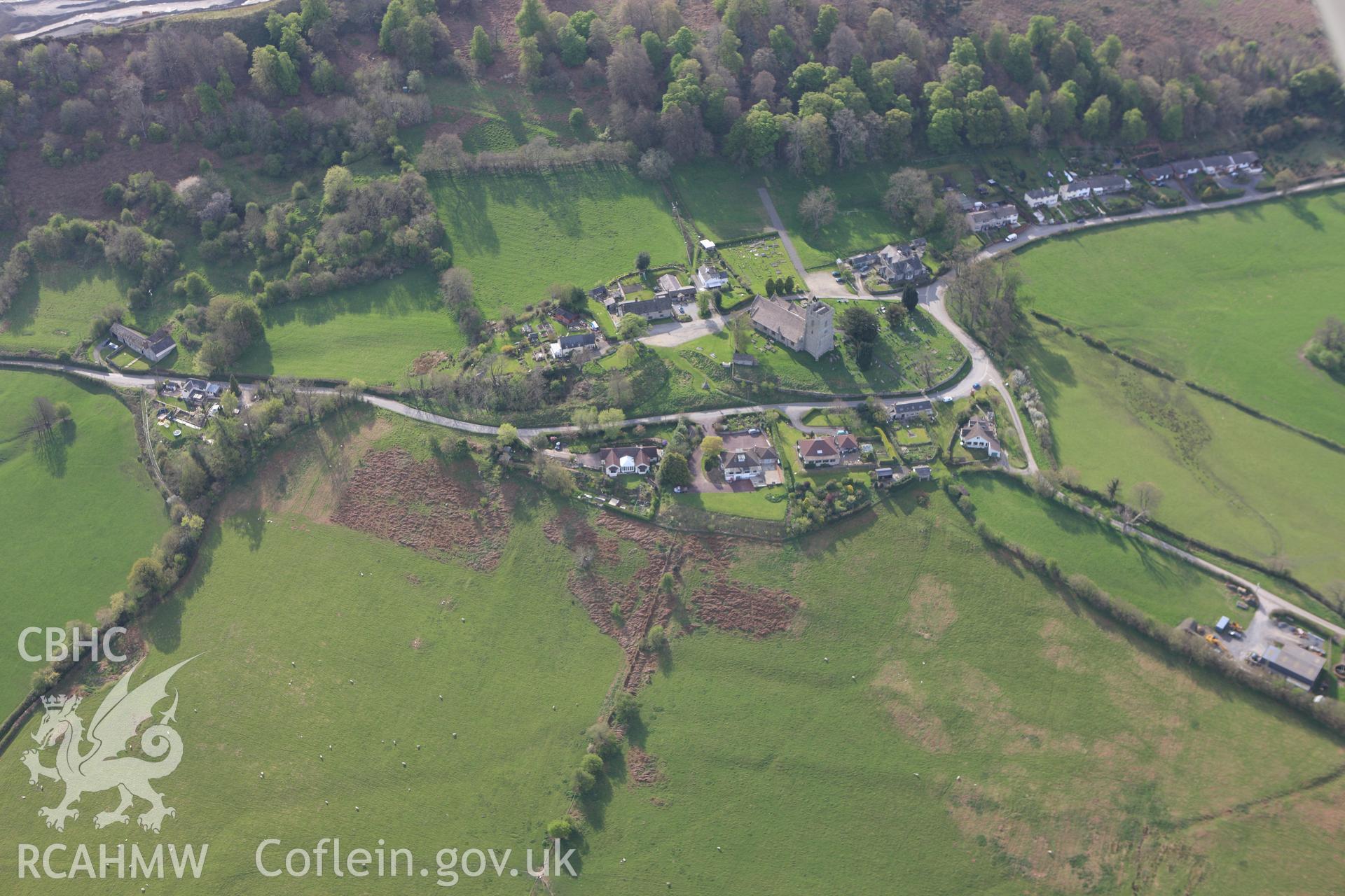 RCAHMW colour oblique aerial photograph of St Stephen's Church, Old Radnor, and the village. Taken on 21 April 2009 by Toby Driver