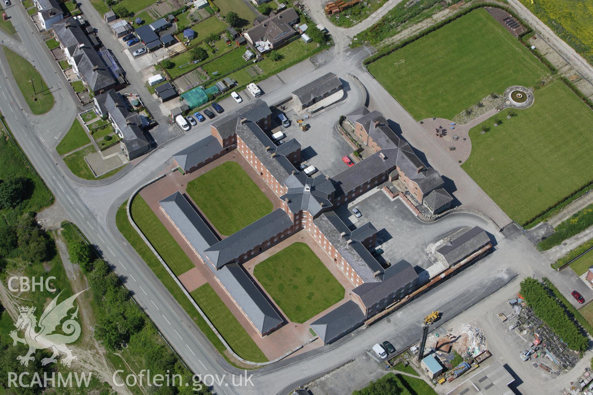 RCAHMW colour oblique aerial photograph of the Union Workhouse, Caersws. Taken on 02 June 2009 by Toby Driver