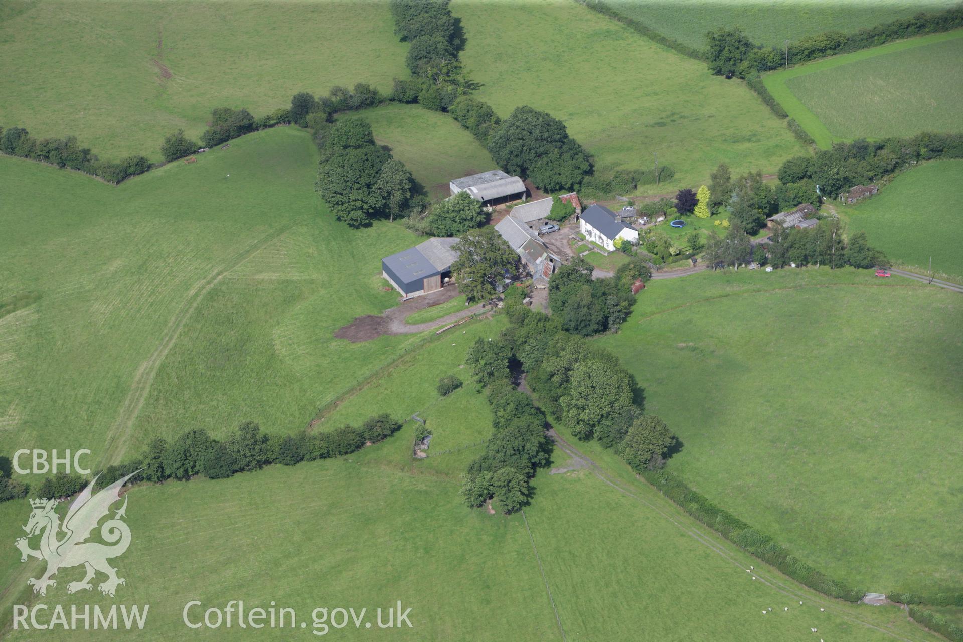 RCAHMW colour oblique aerial photograph of Tregaer Defended Enclosure. Taken on 23 July 2009 by Toby Driver