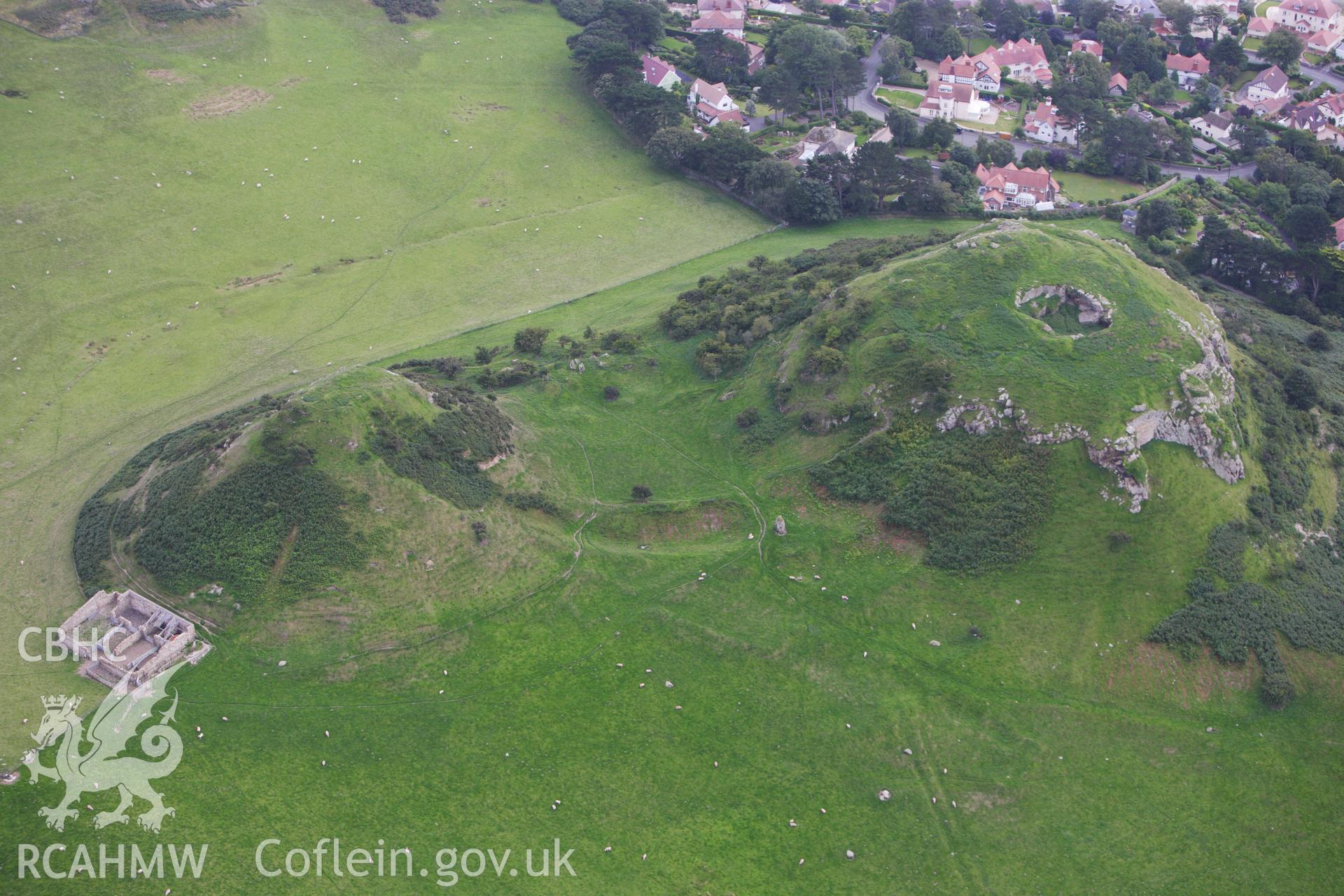 RCAHMW colour oblique aerial photograph of Deganwy Castle. Taken on 06 August 2009 by Toby Driver