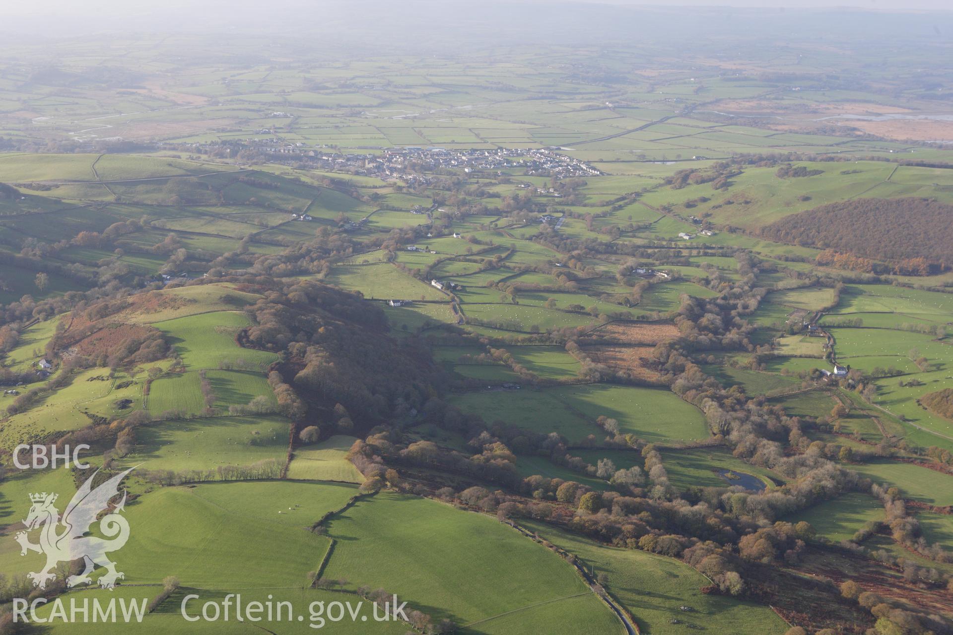 RCAHMW colour oblique aerial photograph of Tregaron and surrounding landscape from the east. Taken on 09 November 2009 by Toby Driver