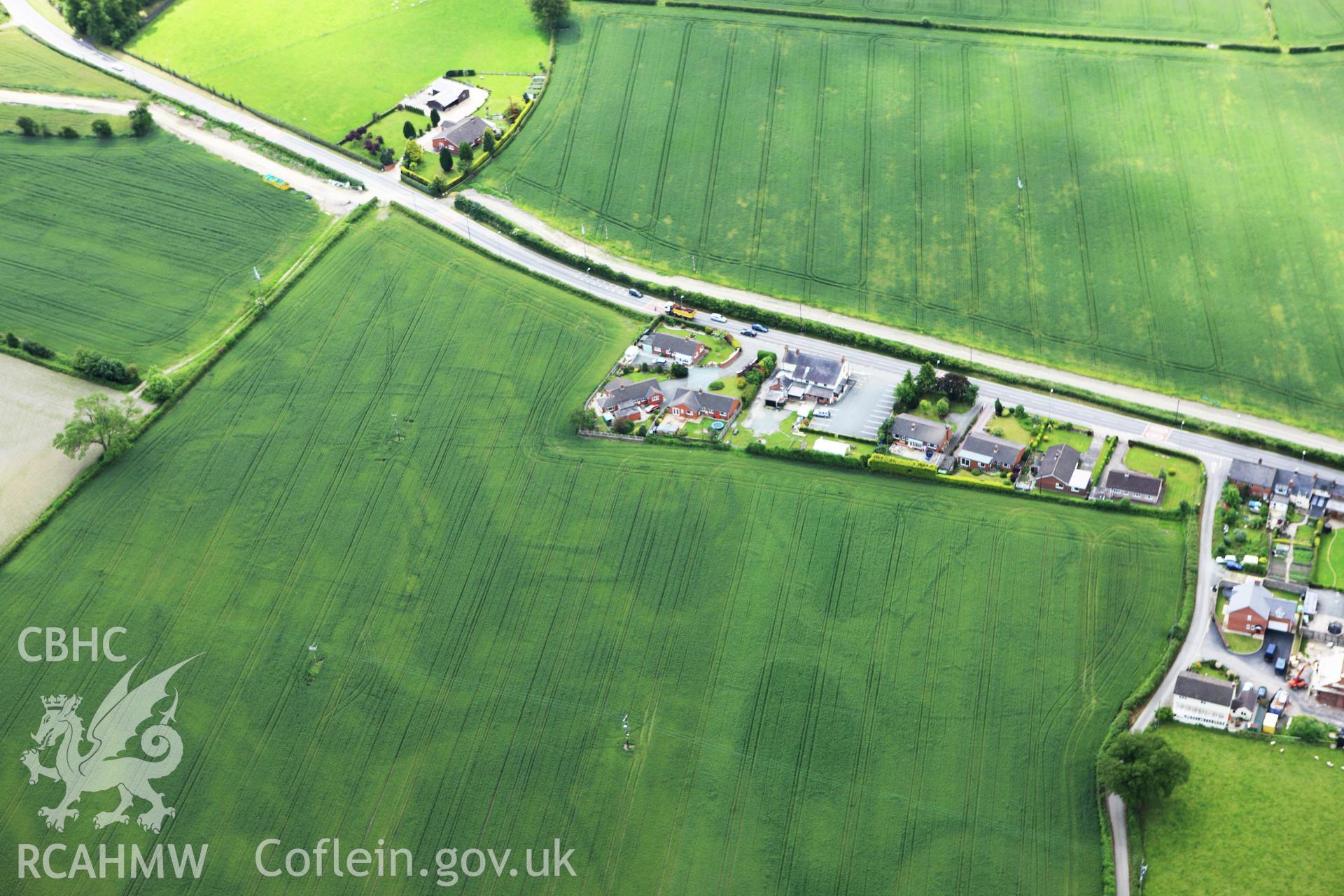 RCAHMW colour oblique photograph of Defended enclosure,Llandrinio. Taken by Toby Driver on 19/06/2009.