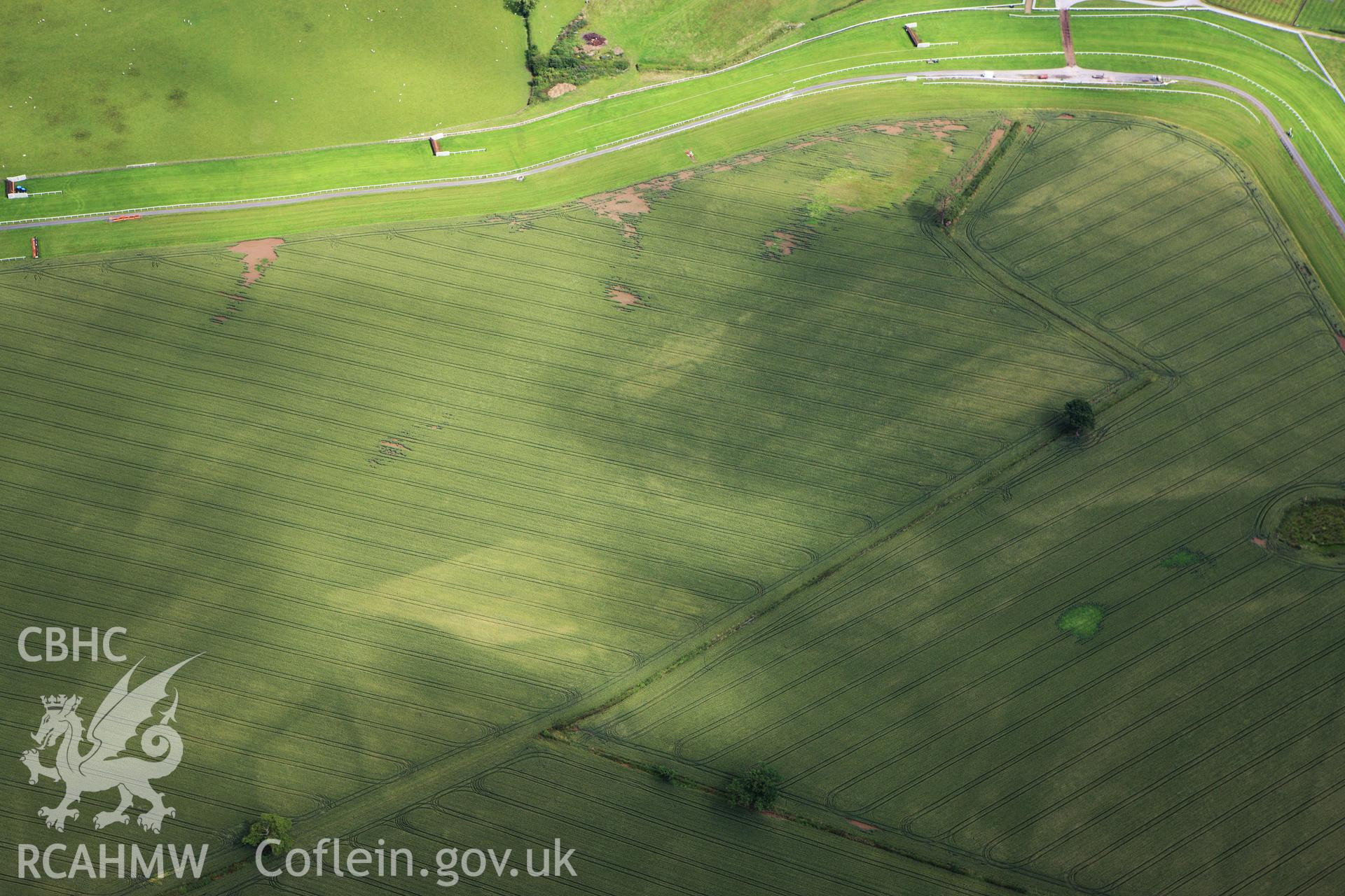 RCAHMW colour oblique aerial photograph of Bangor Race Course Enclosure. Taken on 08 July 2009 by Toby Driver