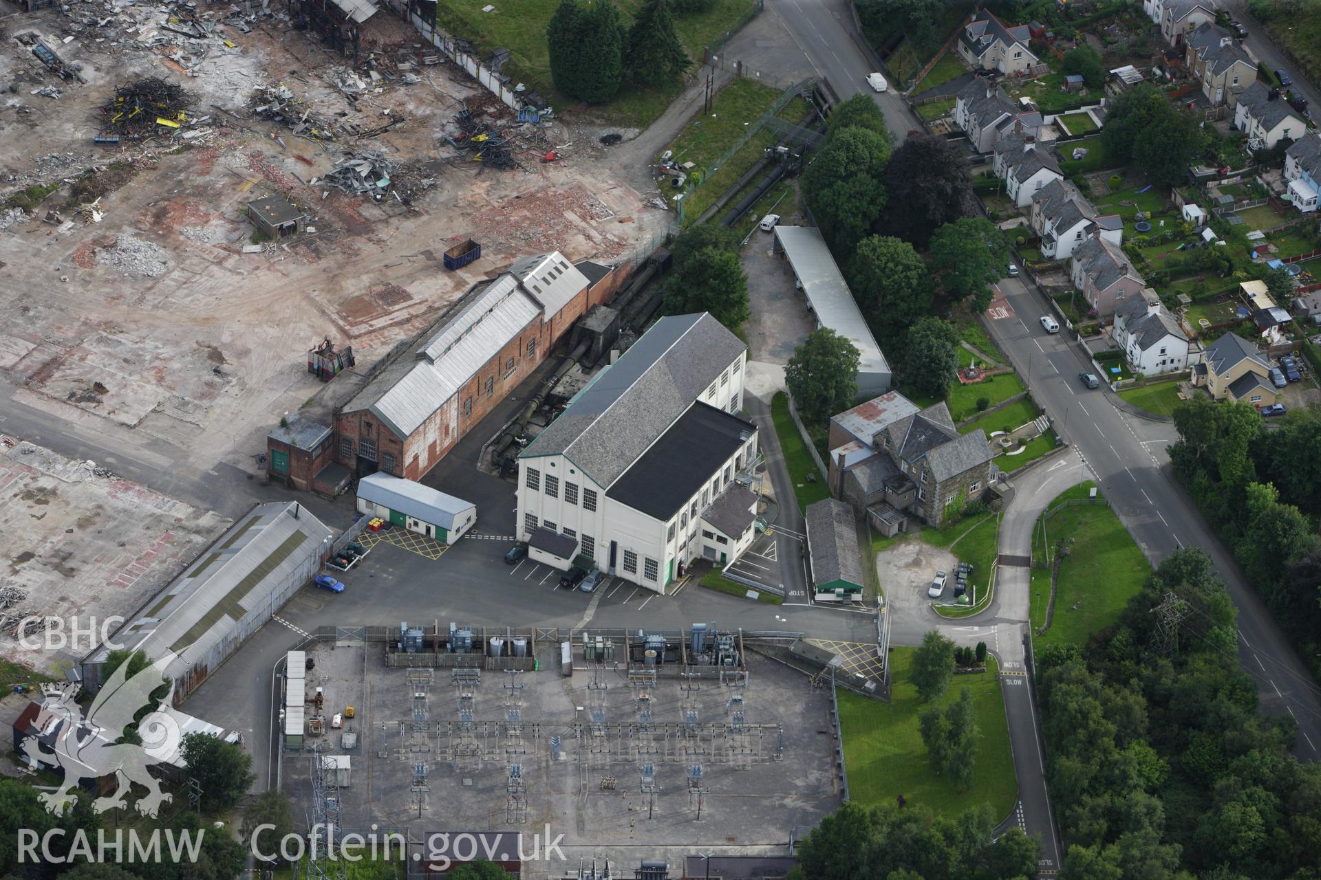 RCAHMW colour oblique aerial photograph of Dolgarrog Aluminium Works during demolition. Taken on 06 August 2009 by Toby Driver