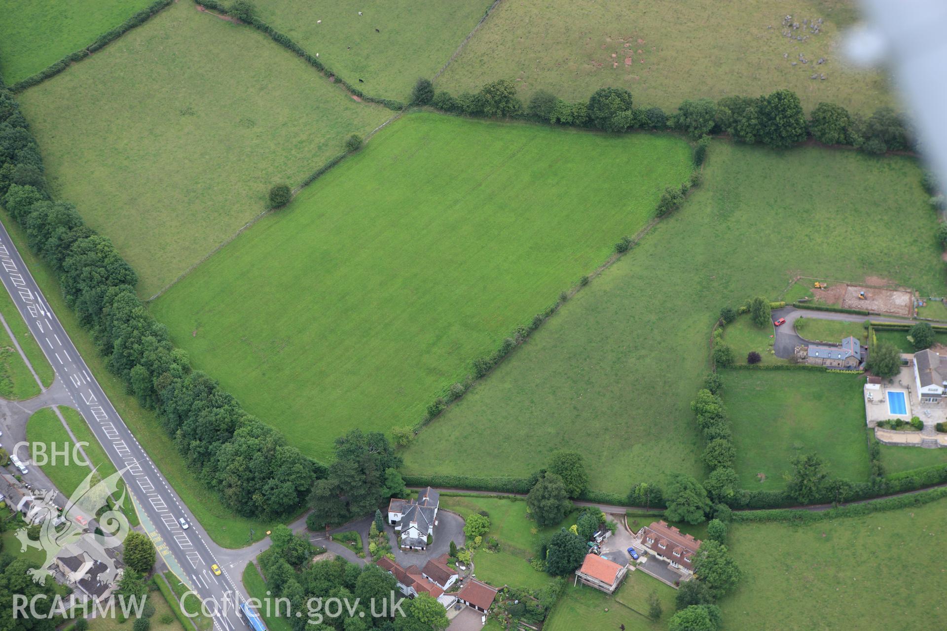RCAHMW colour oblique aerial photograph of Llandevaud Cropmark Enclosure. Taken on 09 July 2009 by Toby Driver