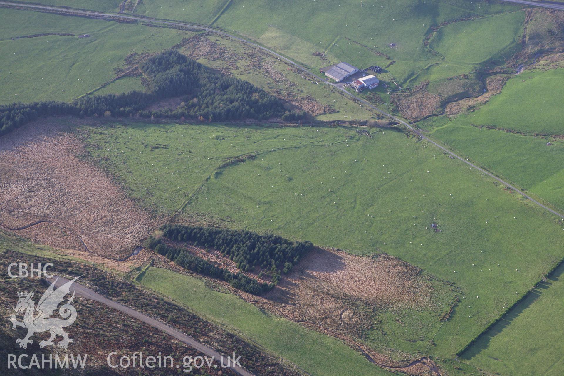 RCAHMW colour oblique aerial photograph of Llys Arthur earthwork. Taken on 09 November 2009 by Toby Driver