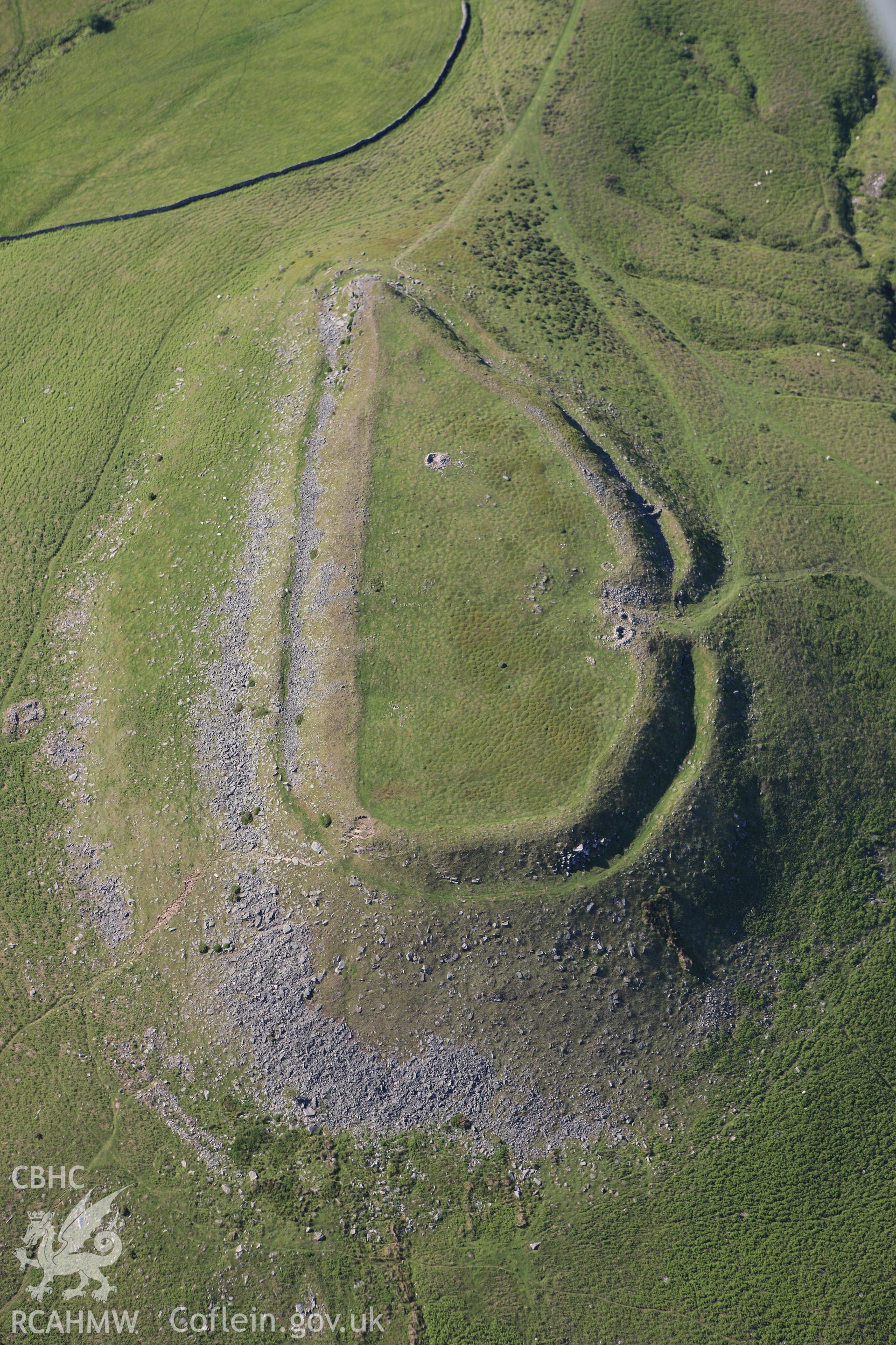RCAHMW colour oblique aerial photograph of Crug Hywel Camp. Taken on 11 June 2009 by Toby Driver