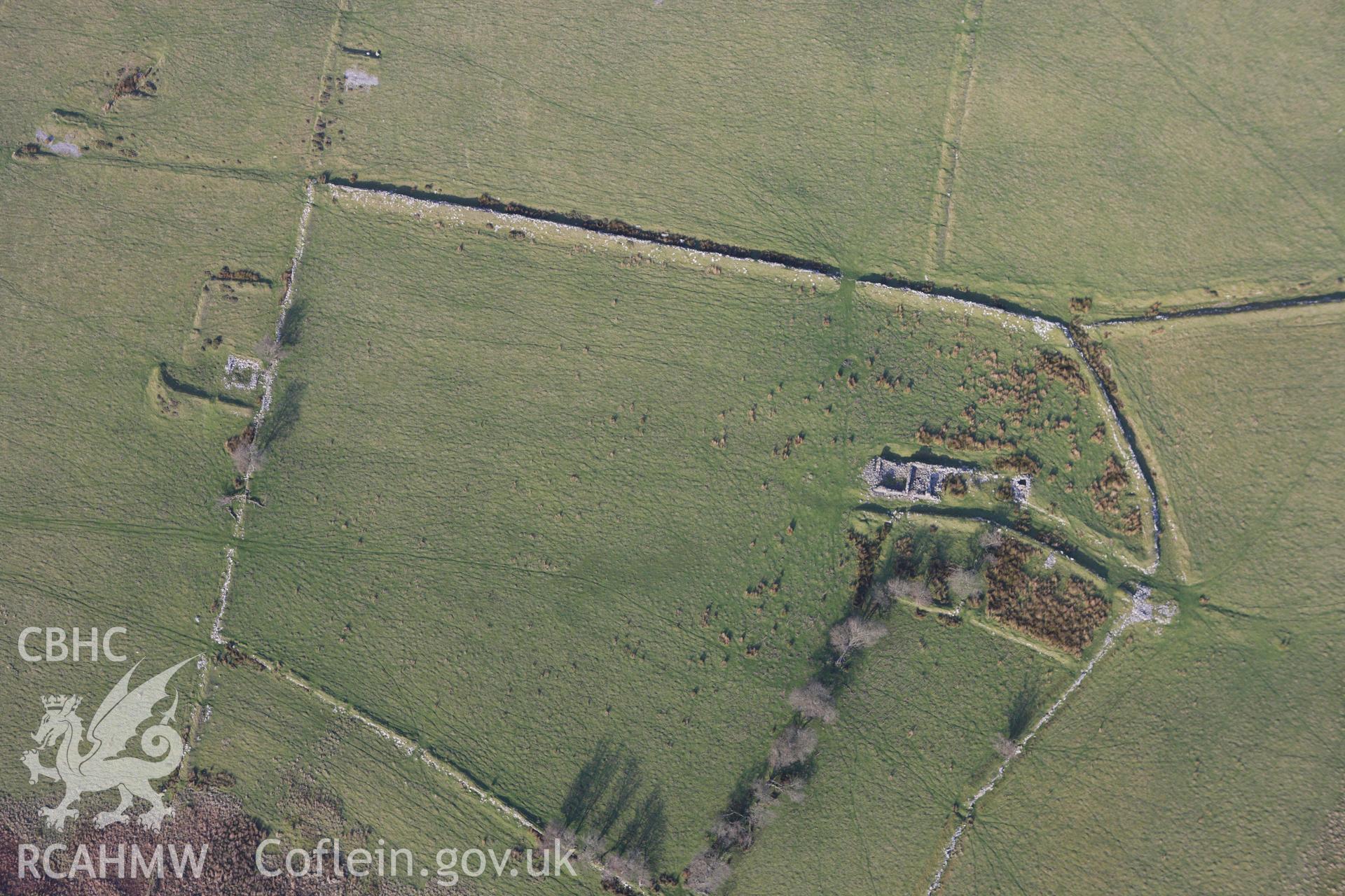 RCAHMW colour oblique aerial photograph of an earthwork complex at Esgair Mwyn Lead Mine. Taken on 09 November 2009 by Toby Driver