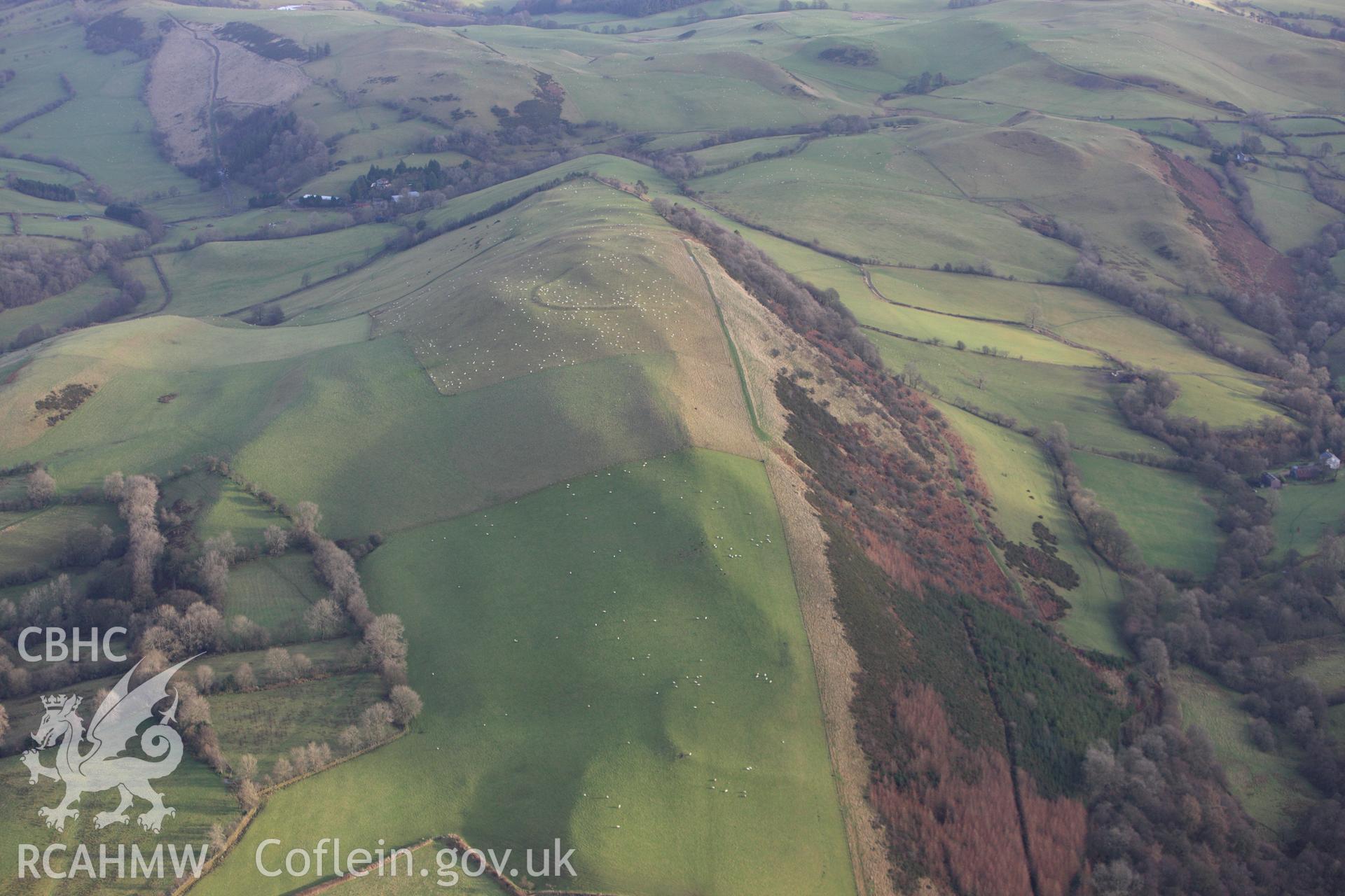 RCAHMW colour oblique aerial photograph of Llyssin Hill Hillfort and Crossdykes. Taken on 10 December 2009 by Toby Driver