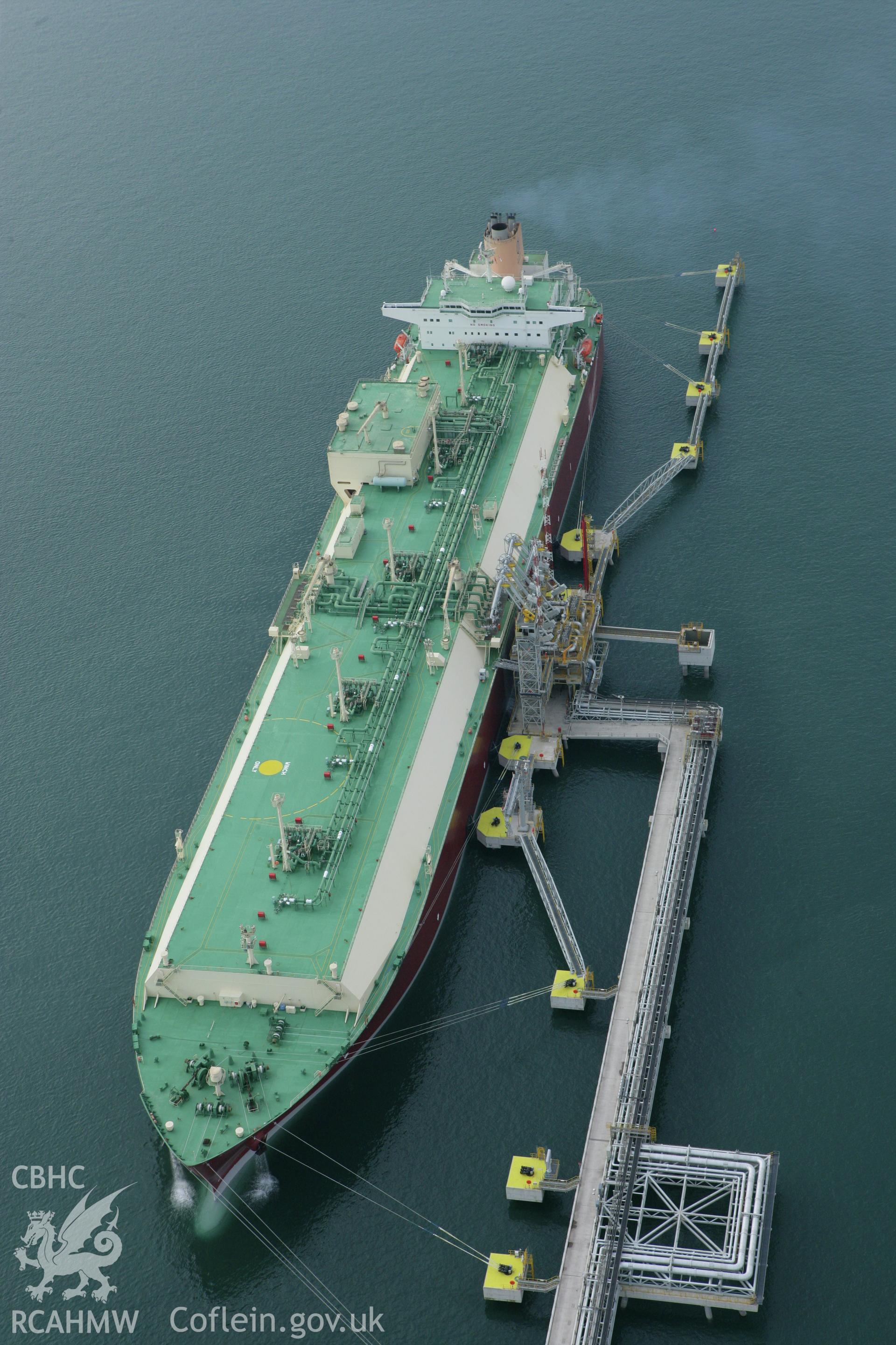 RCAHMW colour oblique aerial photograph of the west jetty at South Hook Point, Milford Haven, showing a tanker delivering liquified natural gas. Taken on 14 October 2009 by Toby Driver