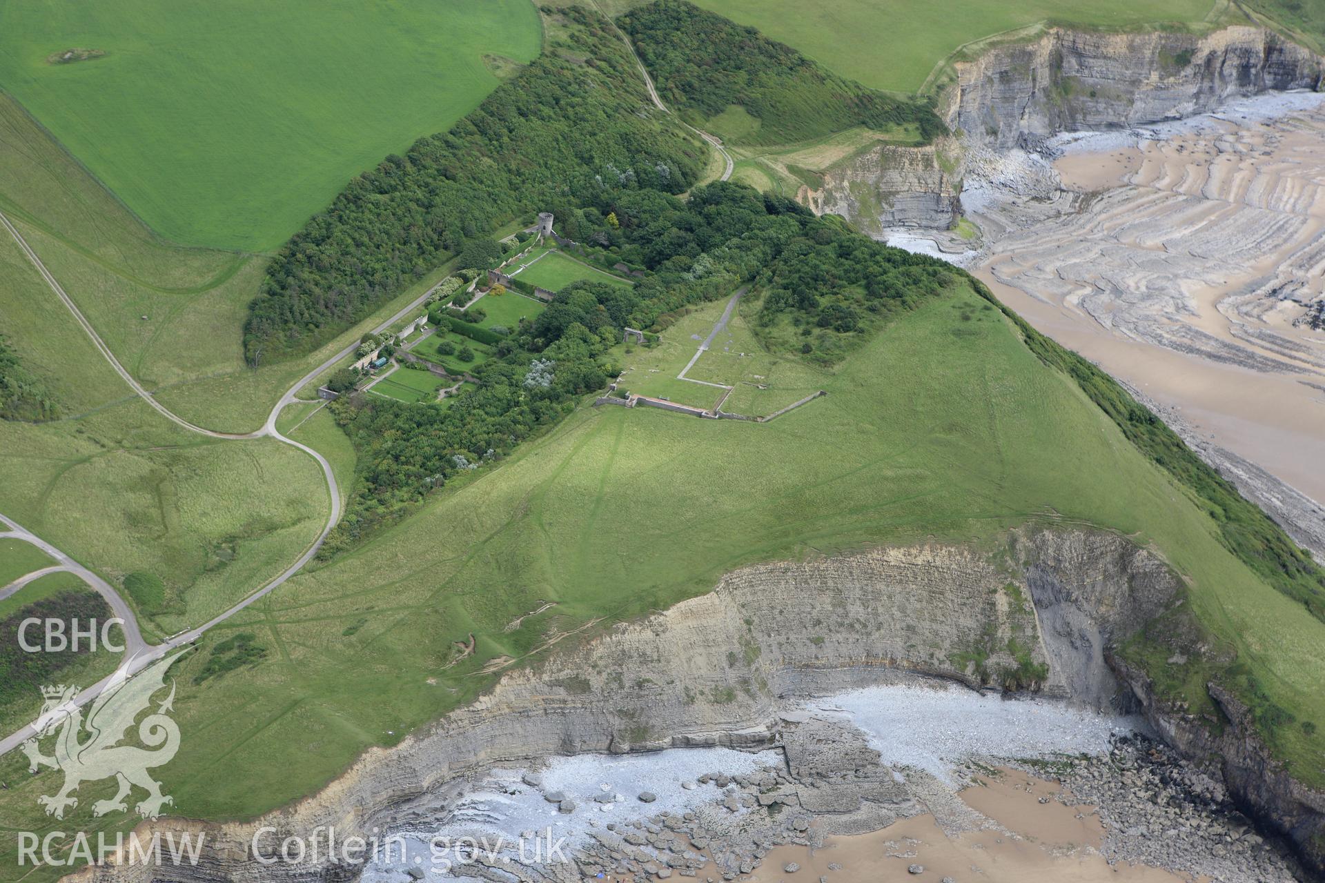 RCAHMW colour oblique aerial photograph of Dunraven Hillfort. Taken on 09 July 2009 by Toby Driver