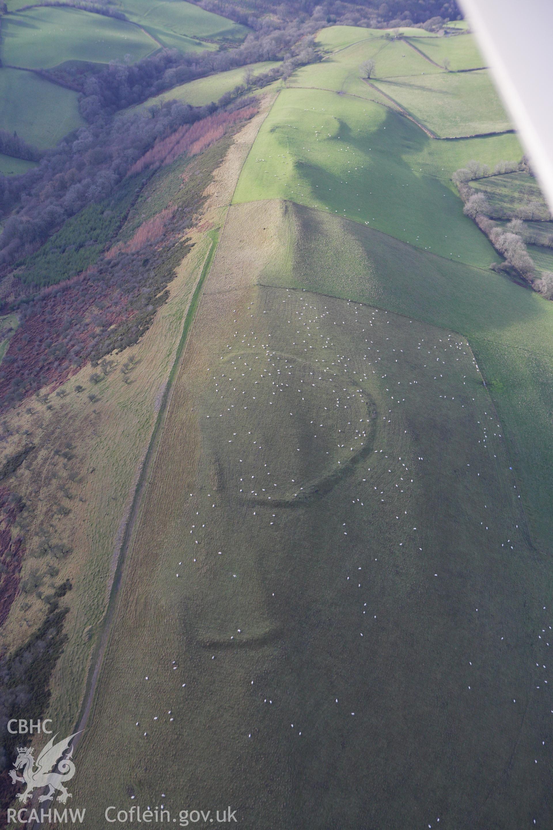 RCAHMW colour oblique aerial photograph of Llyssin Hill Hillfort and Crossdykes. Taken on 10 December 2009 by Toby Driver