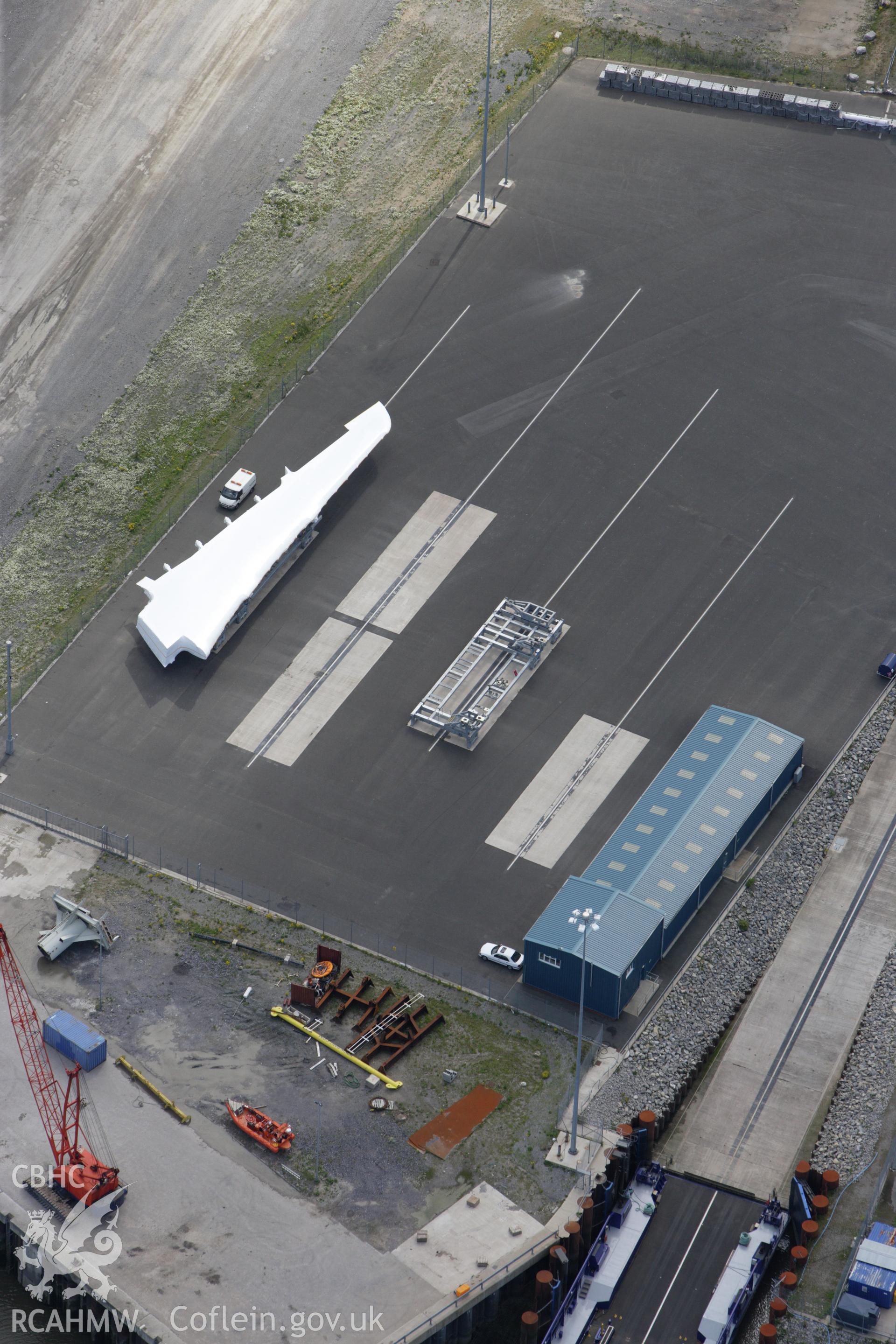 RCAHMW colour oblique aerial photograph of Mostyn Quay, with Airbus wing for shipping. Taken on 30 July 2009 by Toby Driver