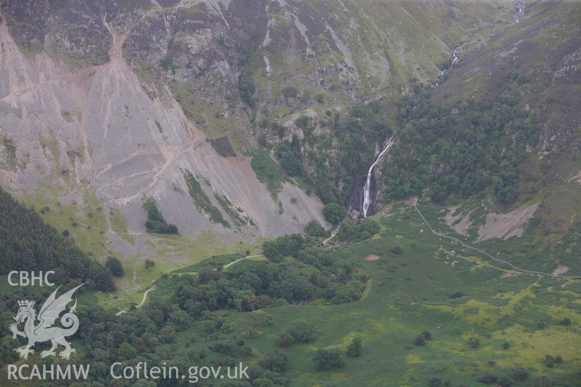 RCAHMW colour oblique aerial photograph of Coedydd Aber National Nature Reserve and Aber Falls. Taken on 06 August 2009 by Toby Driver