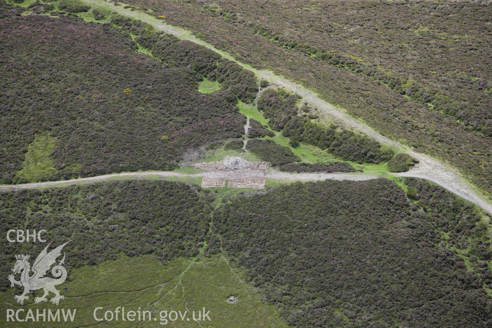 RCAHMW colour oblique aerial photograph of Penycloddiau Cairn. Taken on 30 July 2009 by Toby Driver