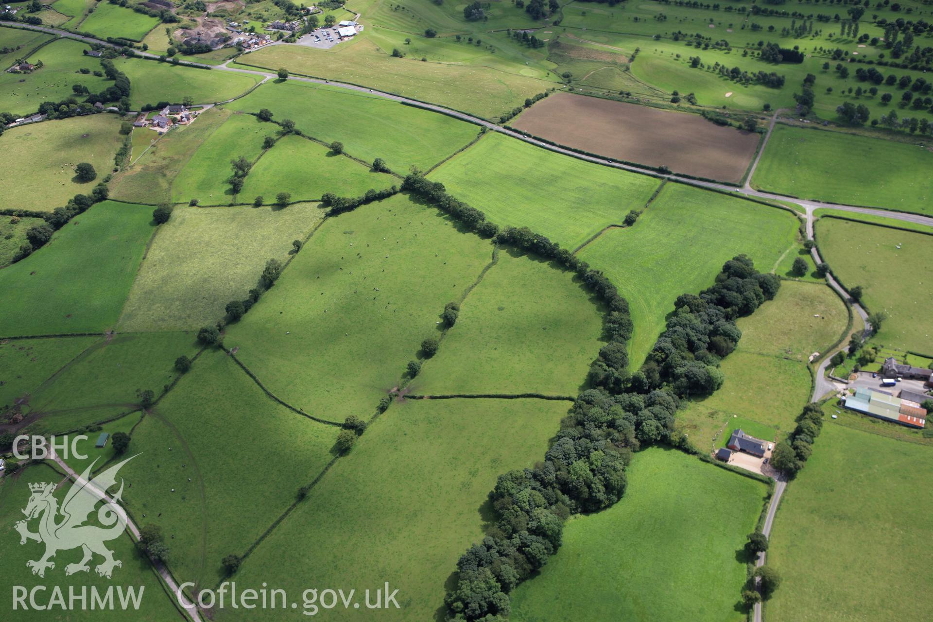 RCAHMW colour oblique aerial photograph of a section of Wat's Dyke from southeast of Whitehouse Farm to southwest of Garreg Llwyd. Taken on 30 July 2009 by Toby Driver