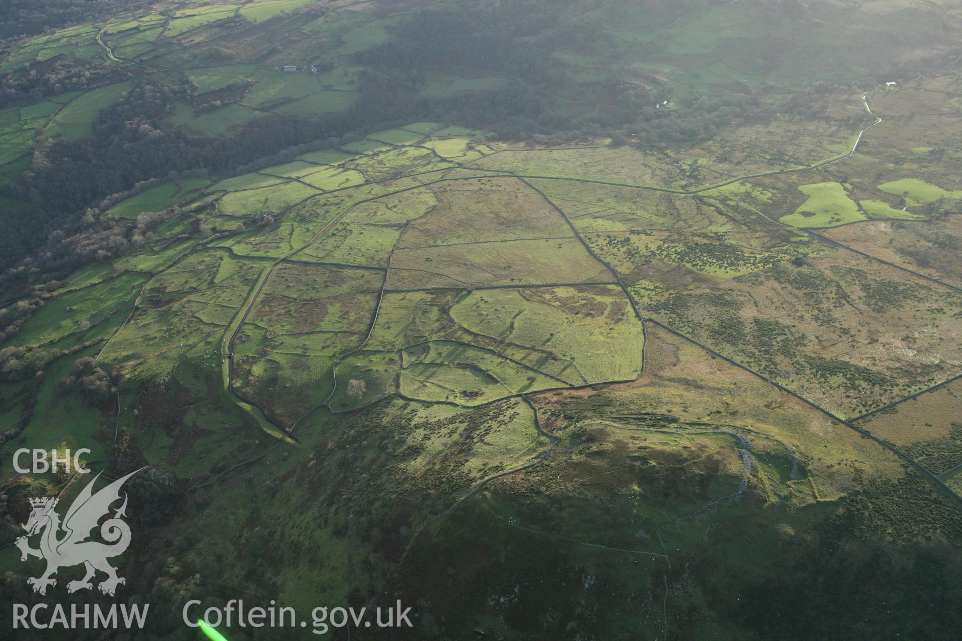 RCAHMW colour oblique aerial photograph of Pen-y-Gaer Hillfort. Taken on 10 December 2009 by Toby Driver