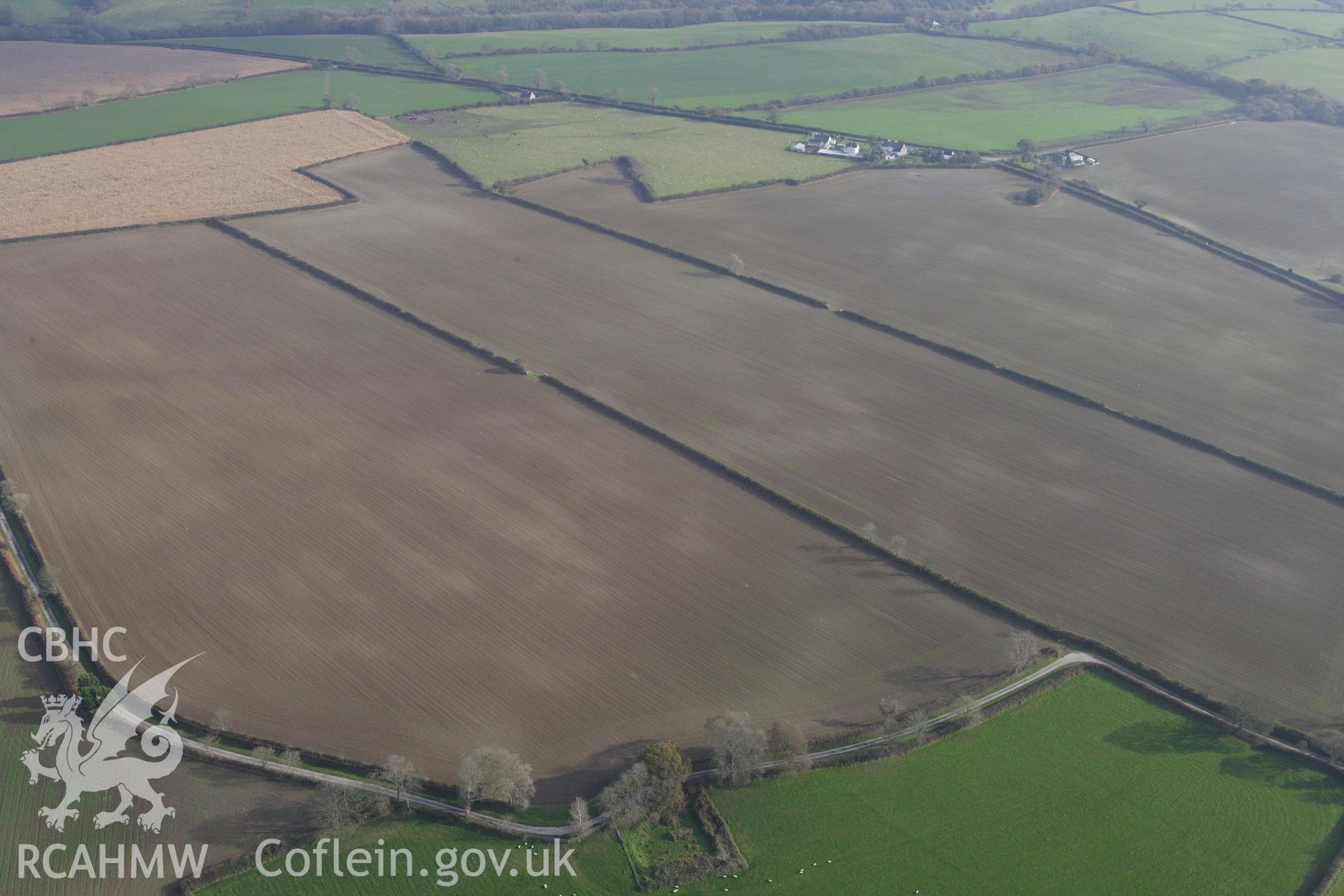 RCAHMW colour oblique aerial photograph of Cawrence Cropmark Enclosure. Taken on 09 November 2009 by Toby Driver