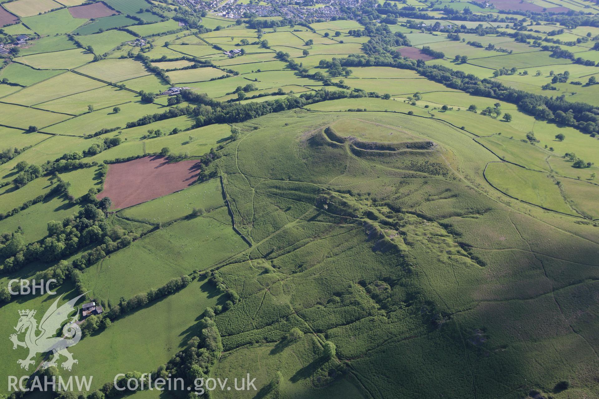 RCAHMW colour oblique aerial photograph of Crug Hywel Camp. Taken on 11 June 2009 by Toby Driver