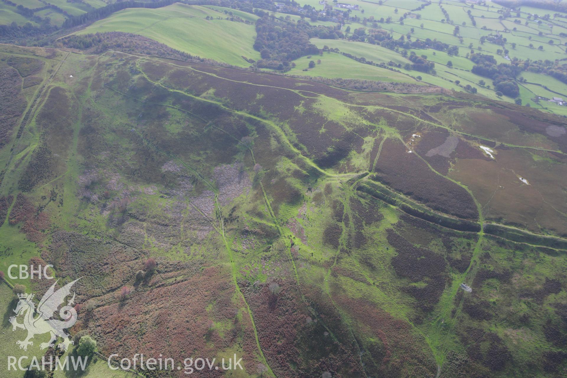 RCAHMW colour oblique aerial photograph of Penycloddiau Hillfort. Taken on 13 October 2009 by Toby Driver