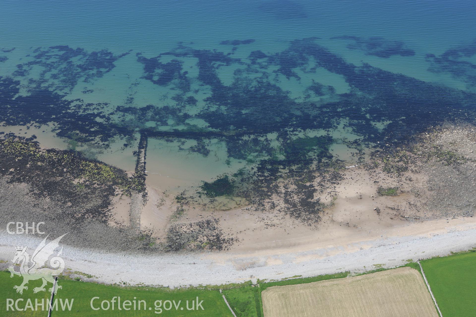 RCAHMW colour oblique aerial photograph of Llwyngwril Fish Trap I. Taken on 02 June 2009 by Toby Driver