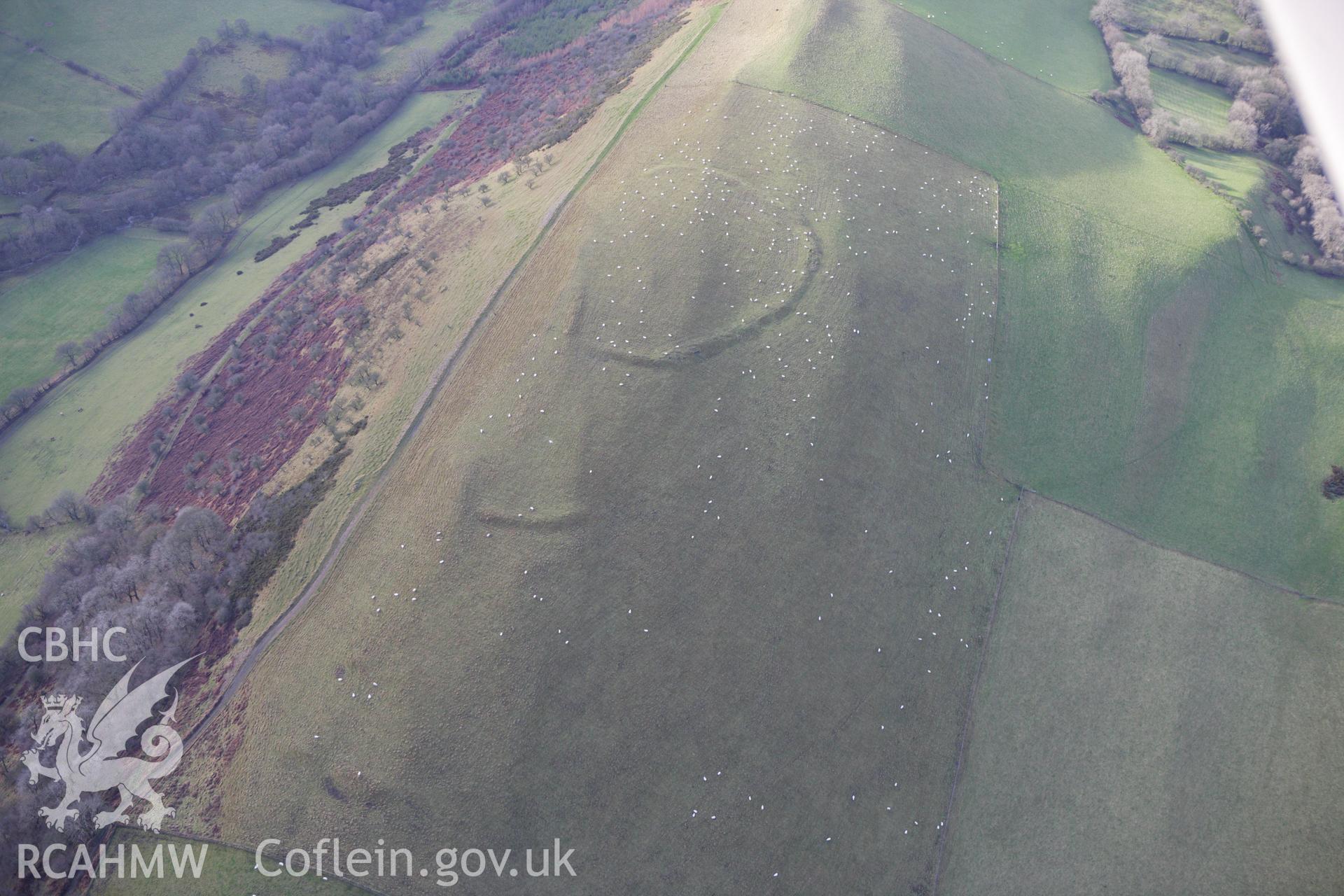 RCAHMW colour oblique aerial photograph of Llyssin Hill Hillfort and Crossdykes. Taken on 10 December 2009 by Toby Driver