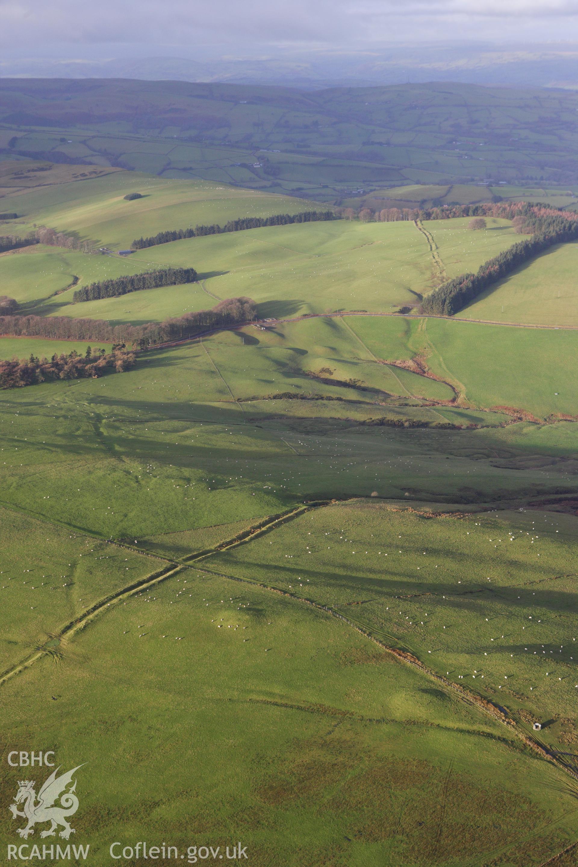 RCAHMW colour oblique aerial photograph of Two Tumps Dyke II and nearby barrows. Taken on 10 December 2009 by Toby Driver