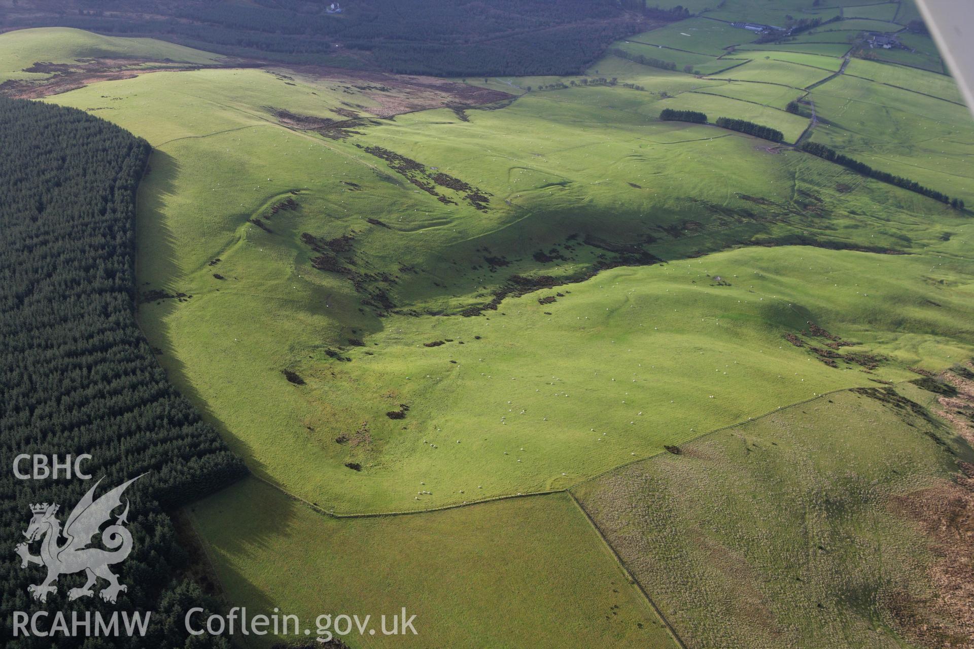 RCAHMW colour oblique aerial photograph of Castell-y-Garn Cairn. Taken on 10 December 2009 by Toby Driver