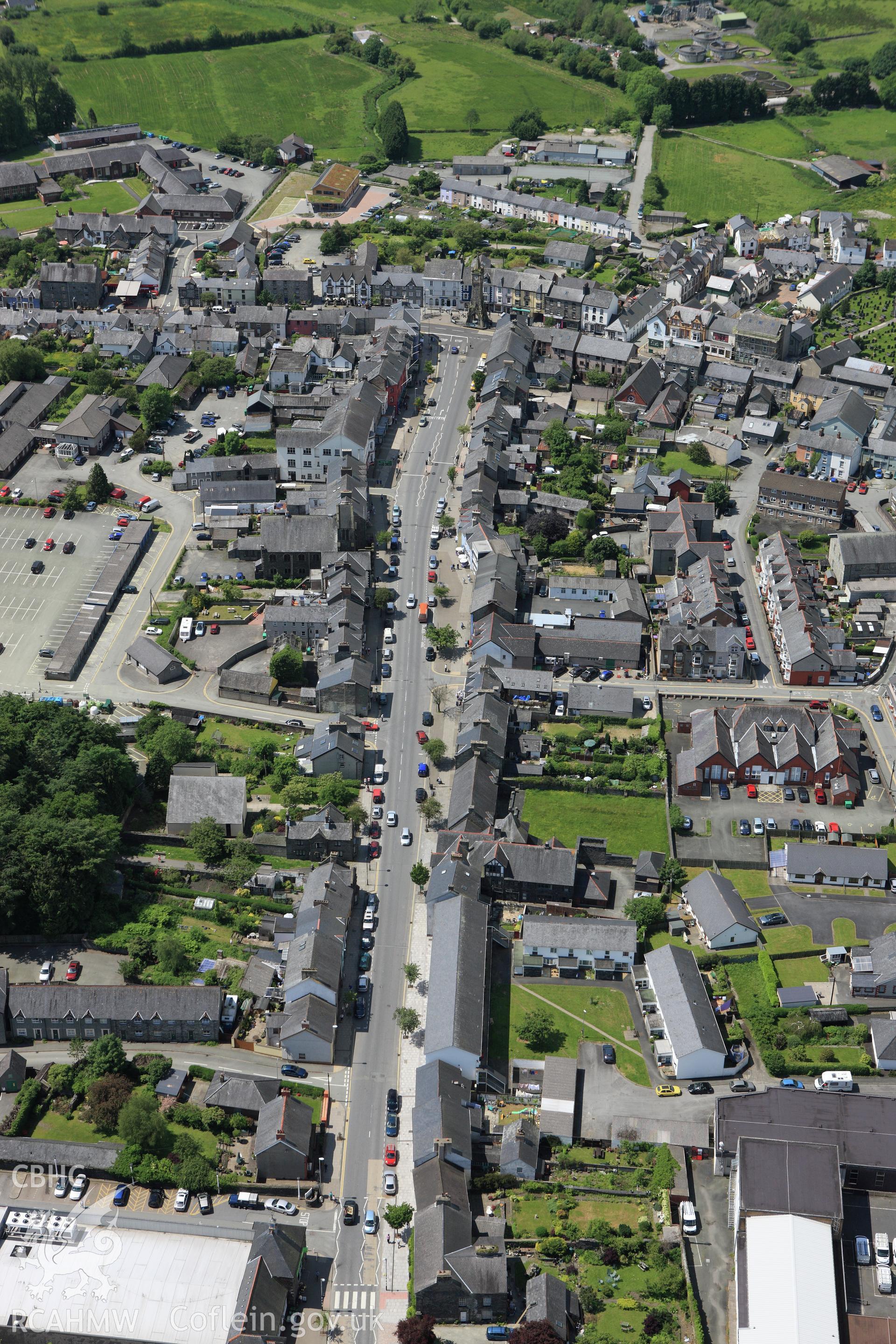 RCAHMW colour oblique aerial photograph of Machynlleth town. Taken on 02 June 2009 by Toby Driver