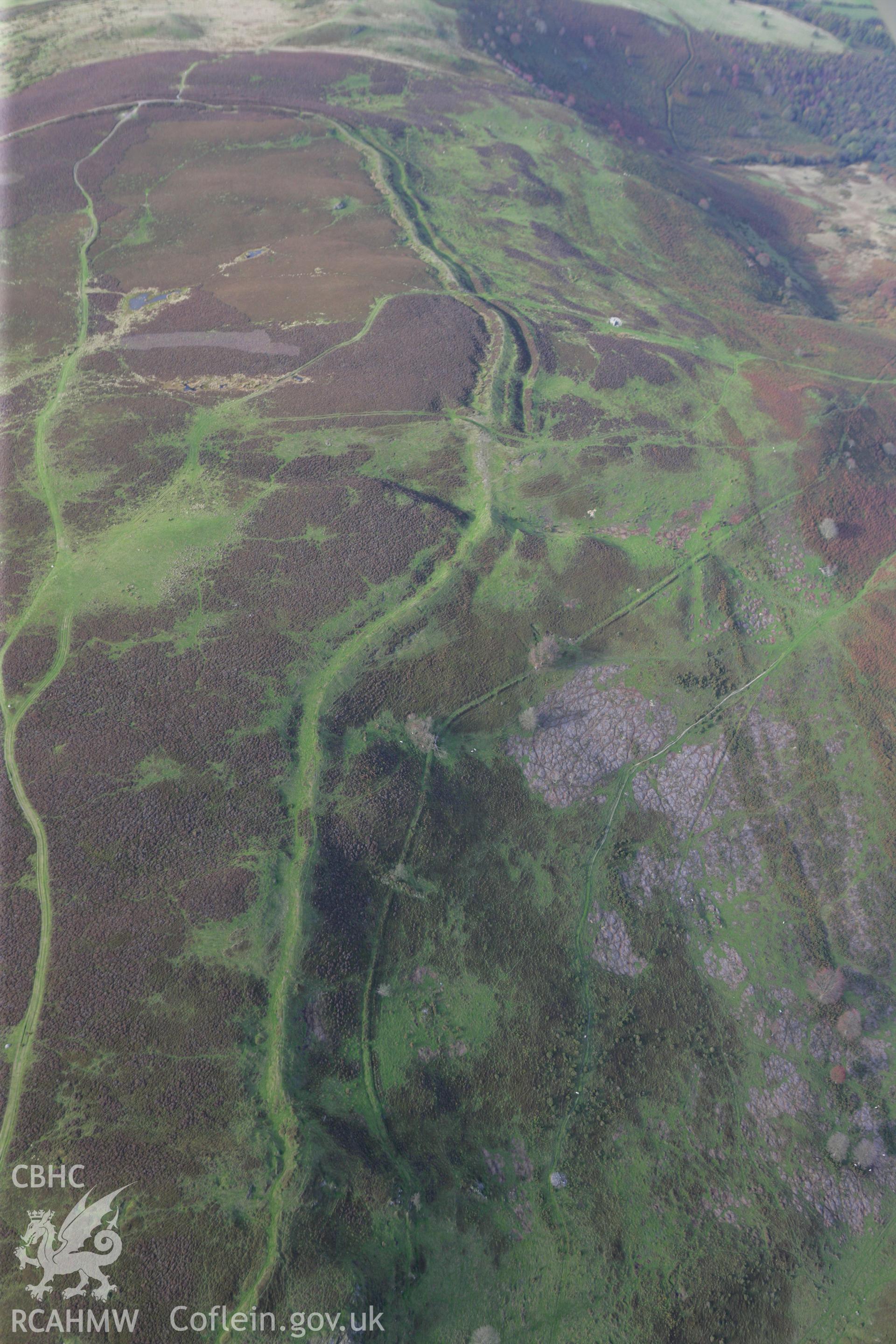 RCAHMW colour oblique aerial photograph of Penycloddiau Hillfort. Taken on 13 October 2009 by Toby Driver