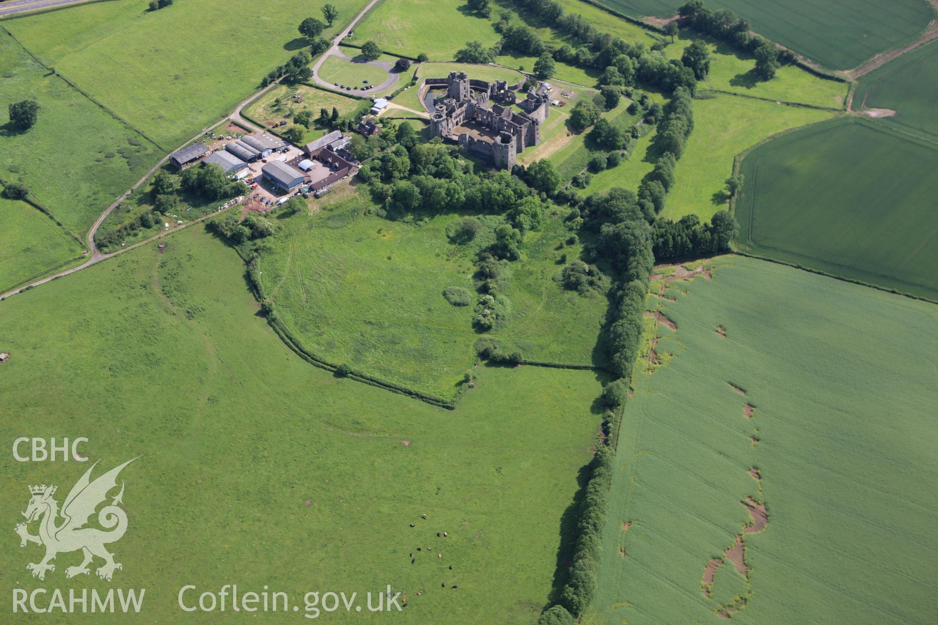 RCAHMW colour oblique aerial photograph of Raglan Castle. Taken on 11 June 2009 by Toby Driver