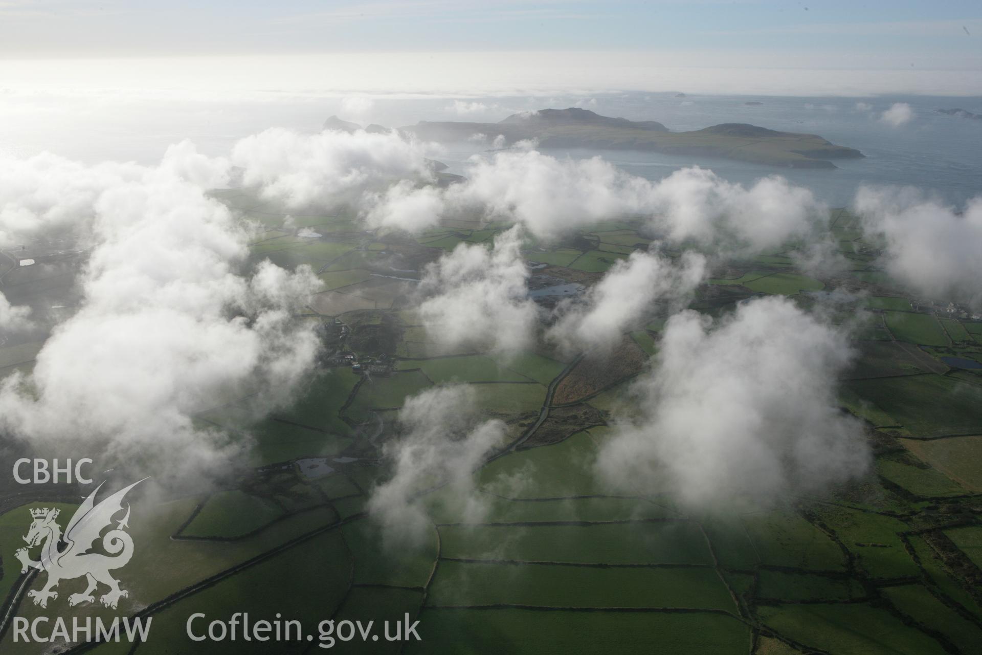 RCAHMW colour oblique aerial photograph of Clegyr Boia and surrounding landscape with cloud. Taken on 28 January 2009 by Toby Driver