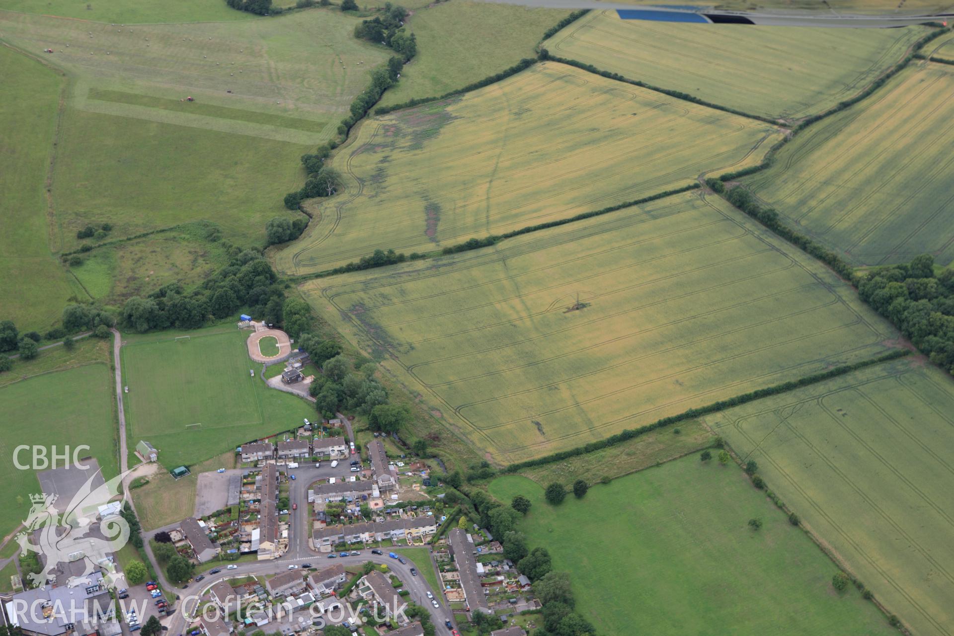 RCAHMW colour oblique aerial photograph of Monks Ditch showing cropmarks of strip field systems. Taken on 09 July 2009 by Toby Driver