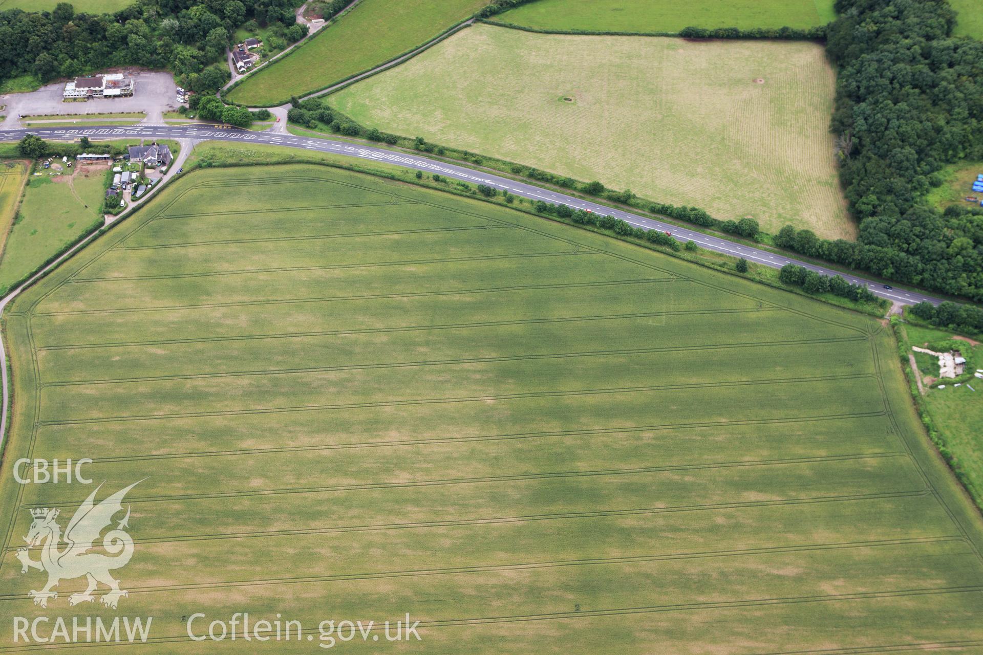 RCAHMW colour oblique aerial photograph of Five Lanes Roman Villa. Taken on 09 July 2009 by Toby Driver