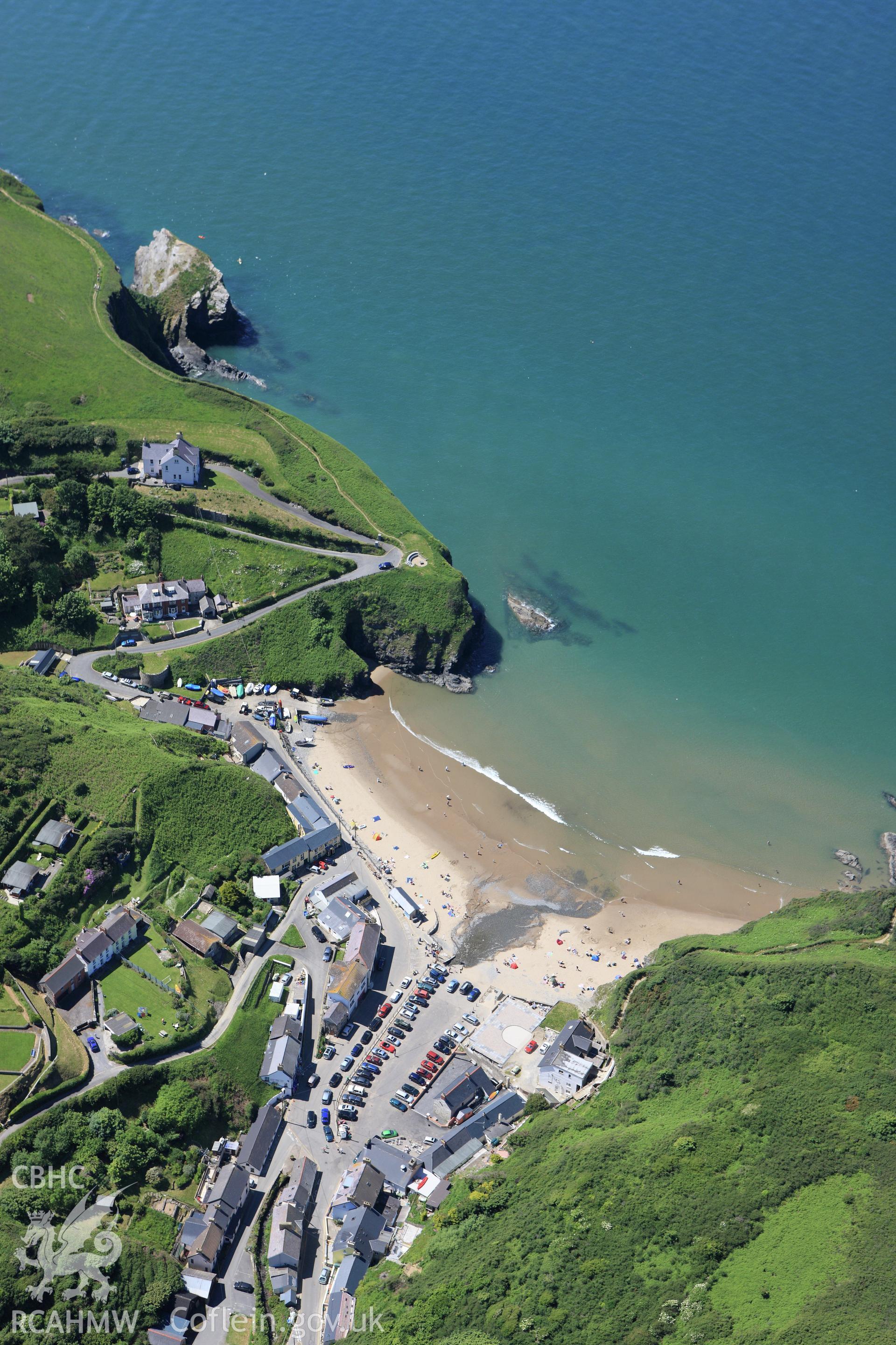 RCAHMW colour oblique aerial photograph of Llangrannog. Taken on 01 June 2009 by Toby Driver