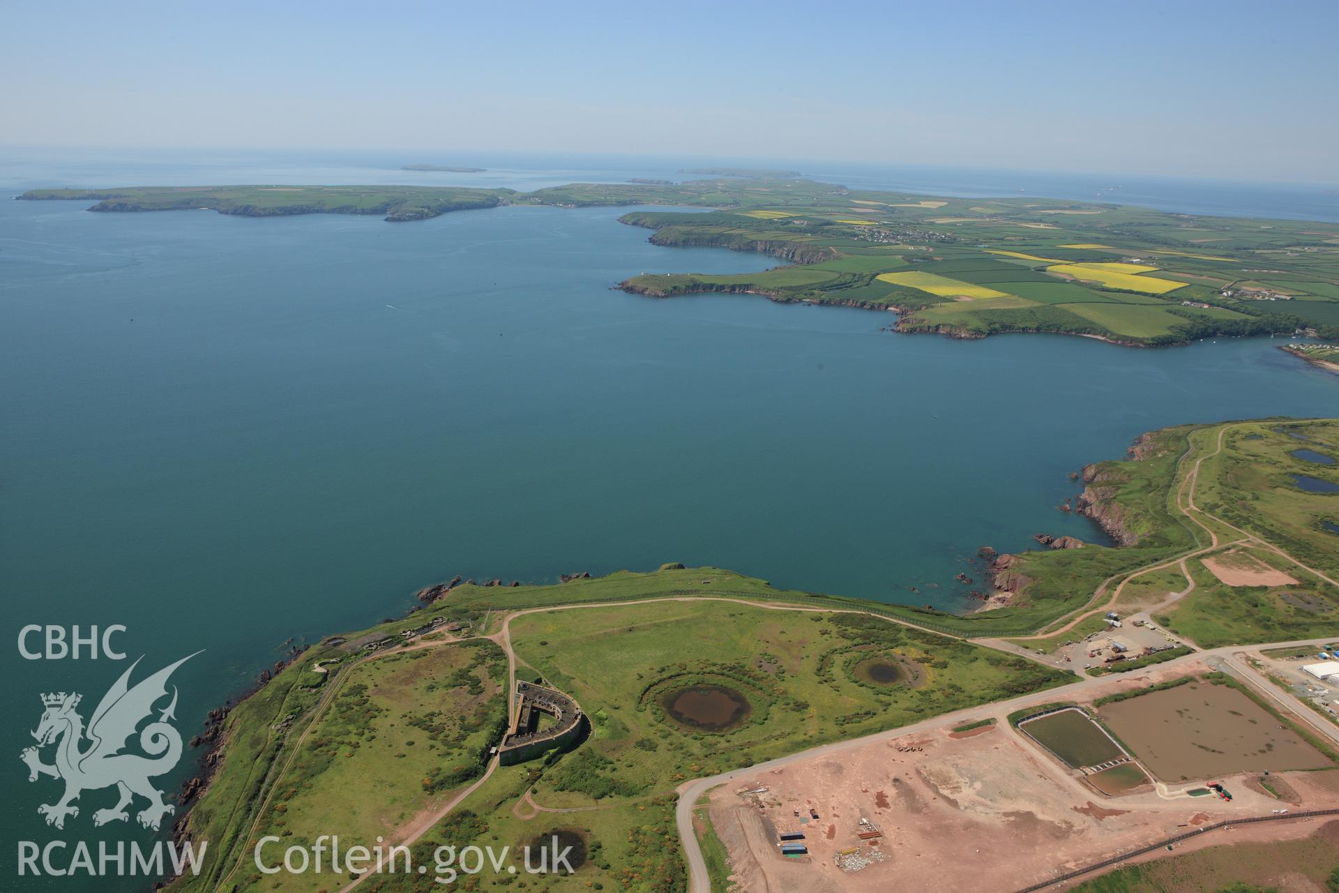 RCAHMW colour oblique aerial photograph of South Hook Fort. A wide view. Taken on 01 June 2009 by Toby Driver