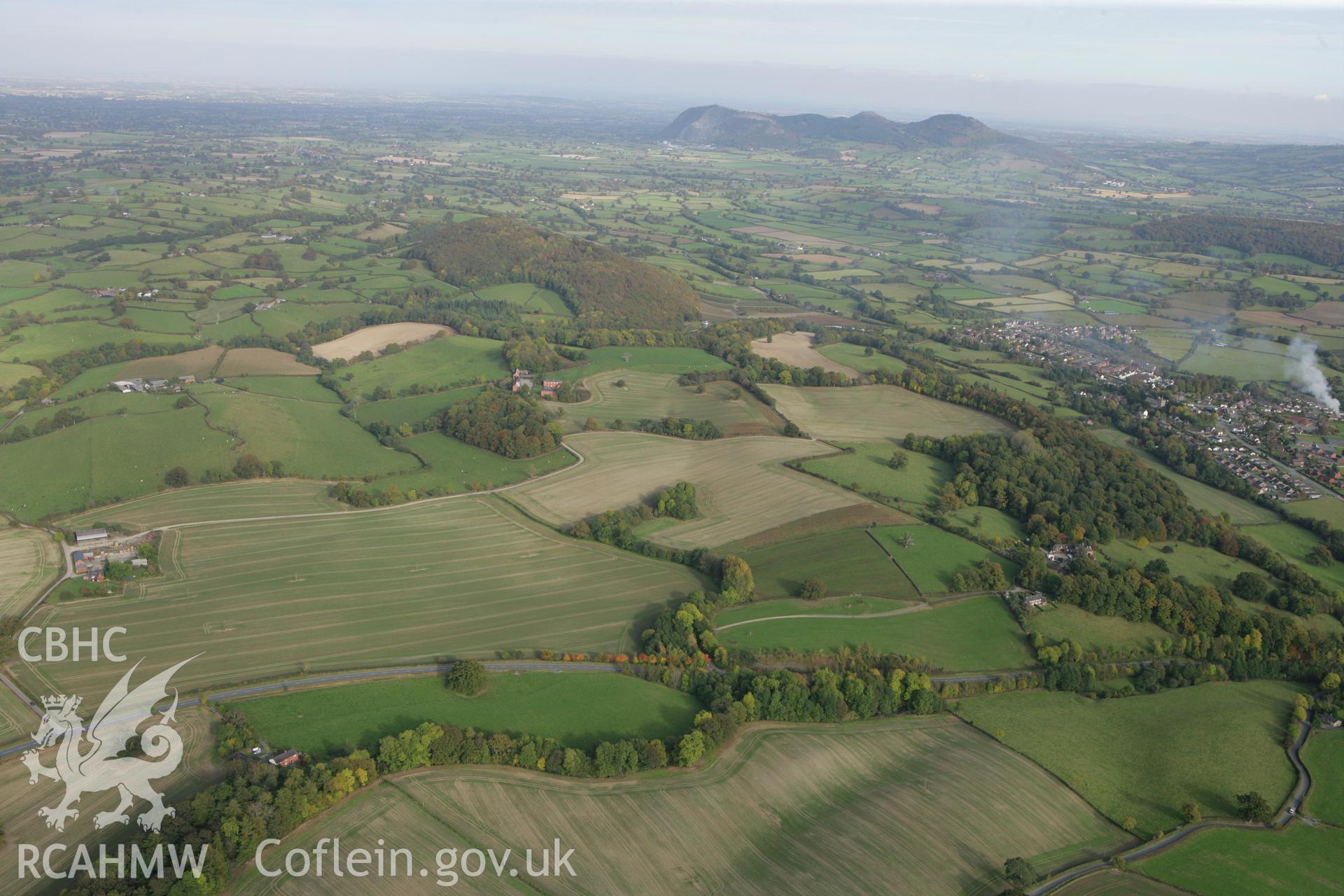 RCAHMW colour oblique aerial photograph of Gaer Fawr, Guilsfield. A landscape view from the west. Taken on 13 October 2009 by Toby Driver