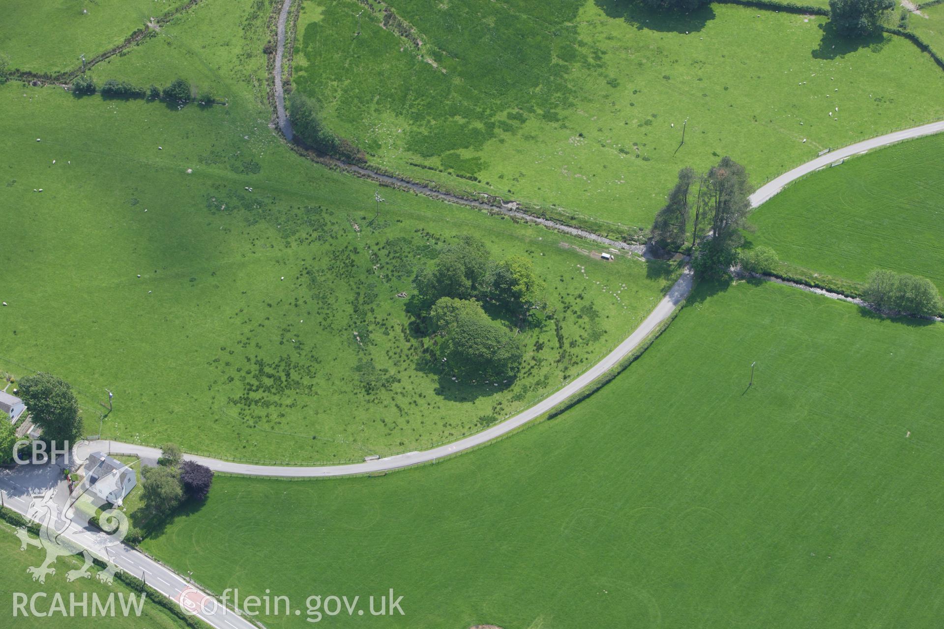 RCAHMW colour oblique aerial photograph of Tomen Las Castle Mound. Taken on 02 June 2009 by Toby Driver
