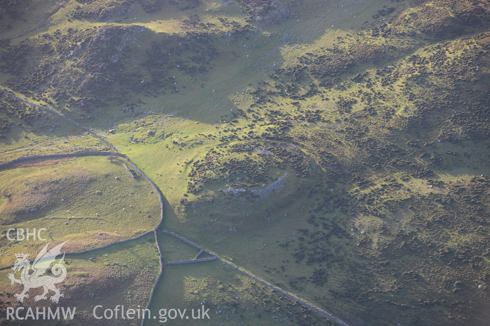 RCAHMW colour oblique aerial photograph of Caer Bach Hillfort. Taken on 10 December 2009 by Toby Driver