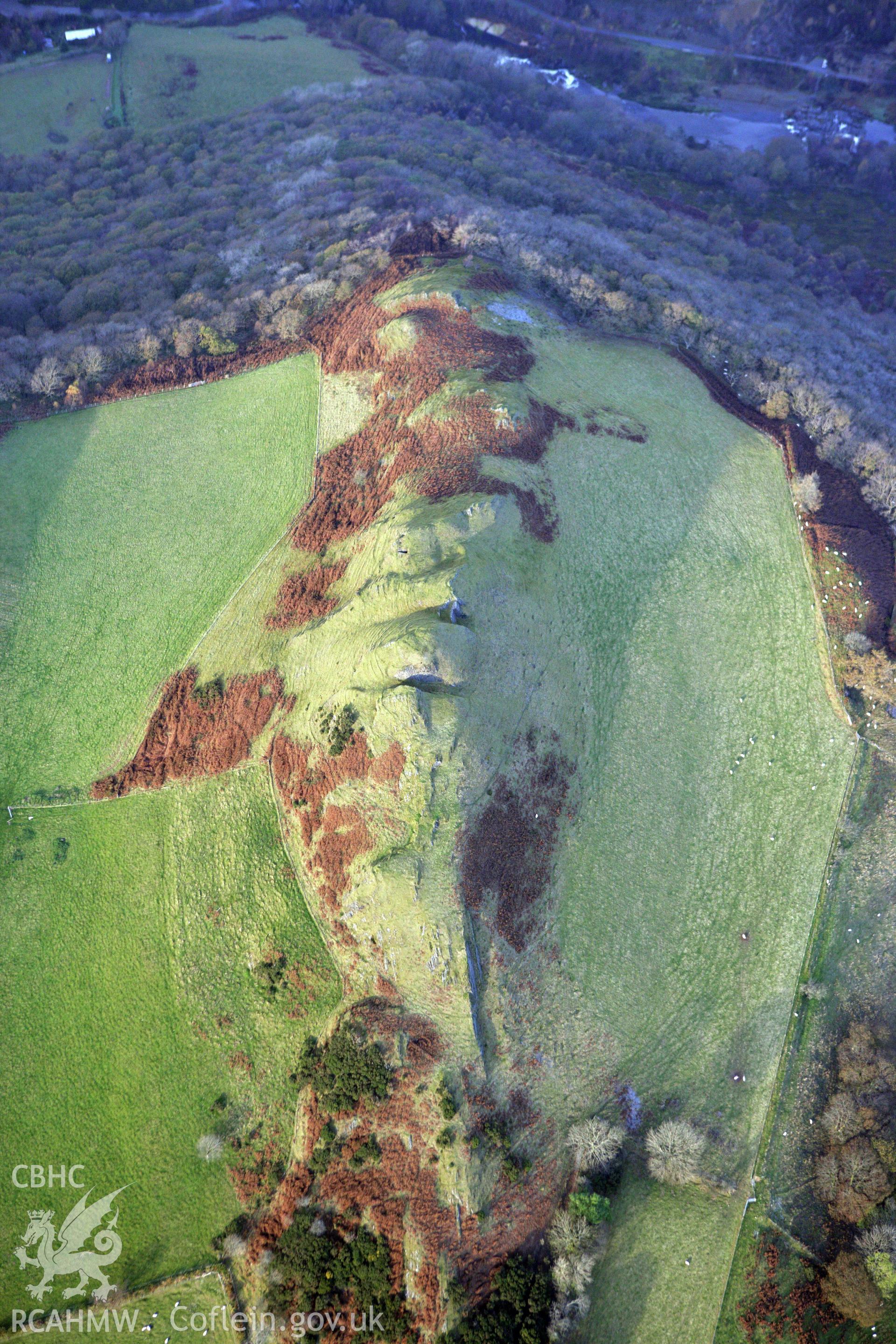 RCAHMW colour oblique aerial photograph of an outcrop at Castell. Taken on 09 November 2009 by Toby Driver