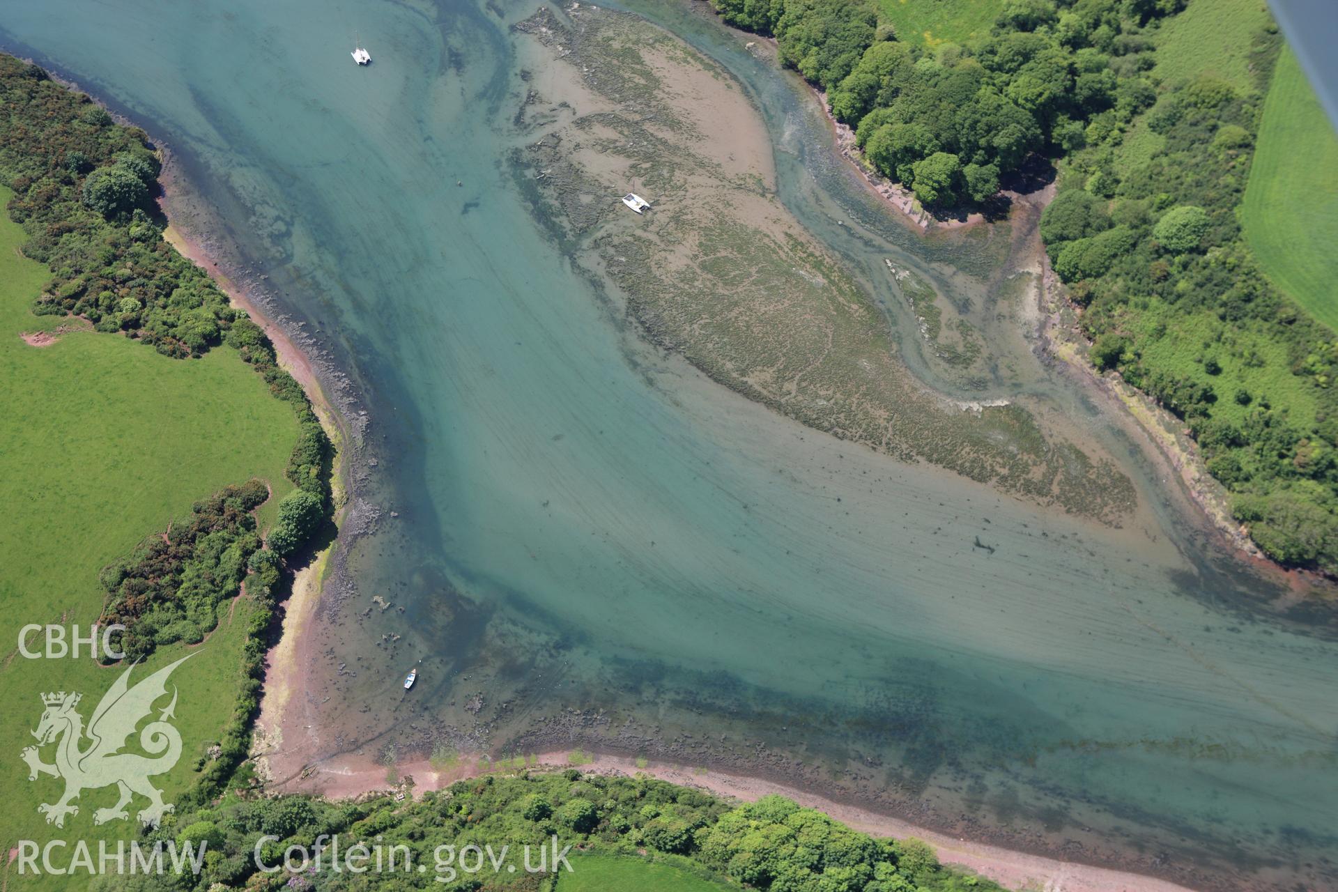 RCAHMW colour oblique aerial photograph of Sandy Haven Pill. Taken on 01 June 2009 by Toby Driver